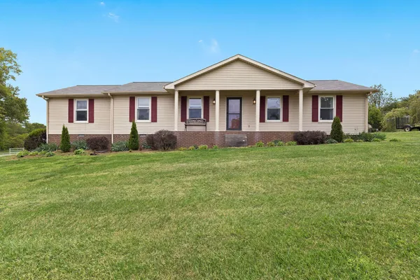 a front of a house with a yard