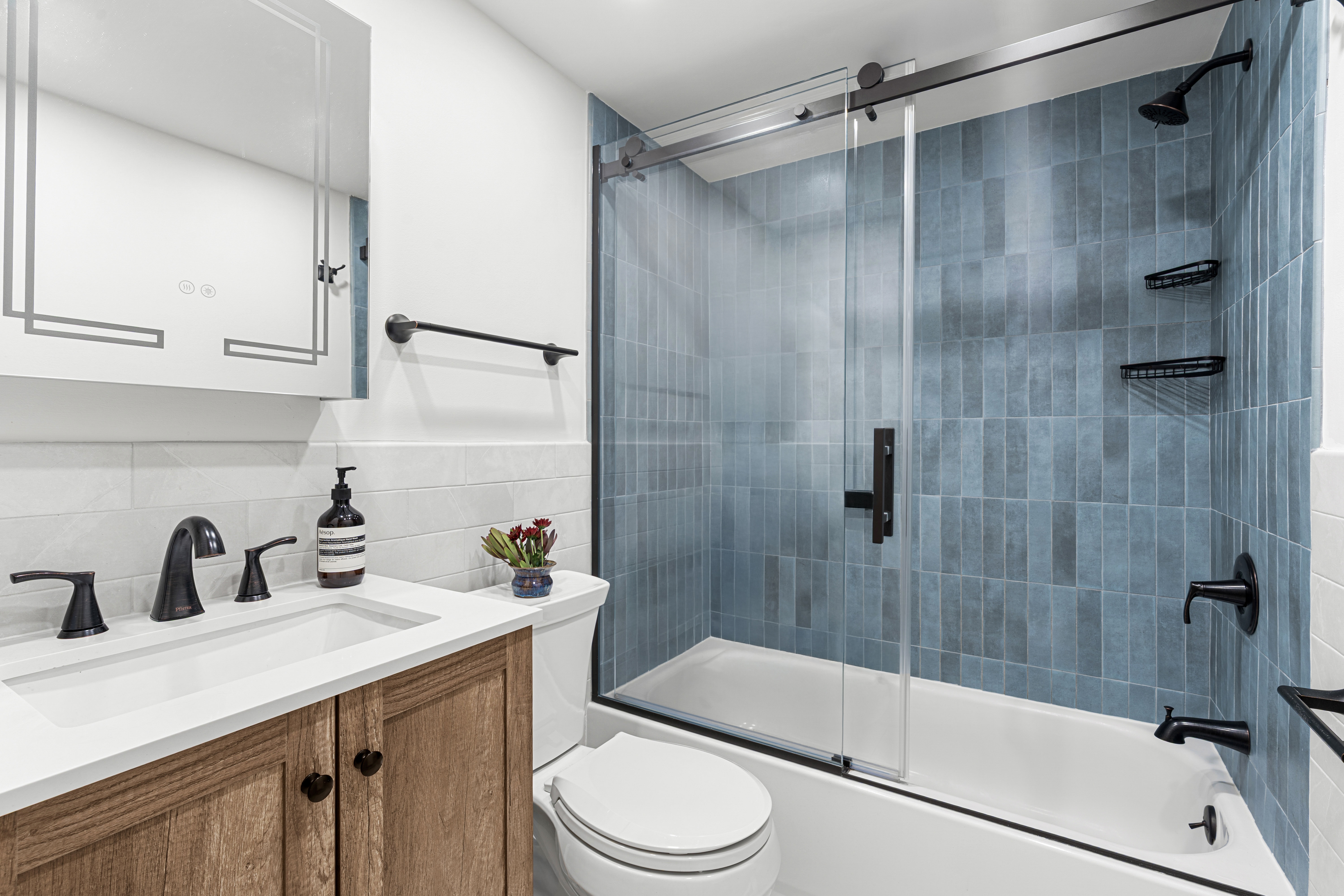 394 12th Street, Unit 5 Brooklyn, NY 11215 - Photo 8 of 14 a bathroom with a sink a toilet and shower