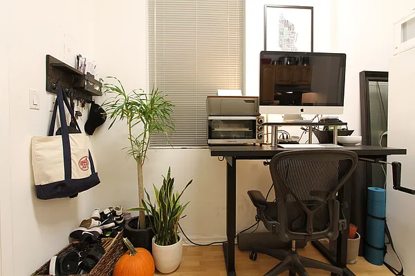 1313 3rd Avenue, Unit 2RN Manhattan, NY 10021 - Photo 2 of 4 a dining room with furniture and potted plants