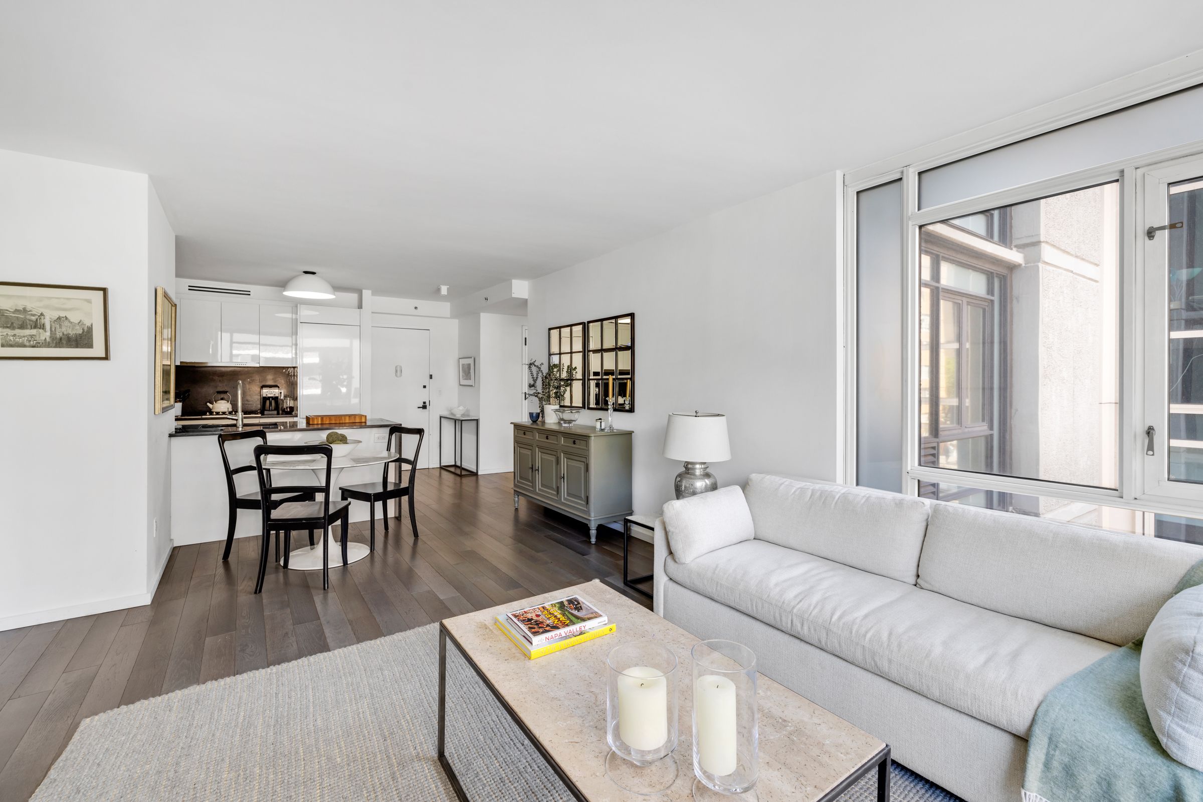 385 1st Avenue, Unit 4B Manhattan, NY 10010 - Photo 4 of 18 a living room with furniture and kitchen view
