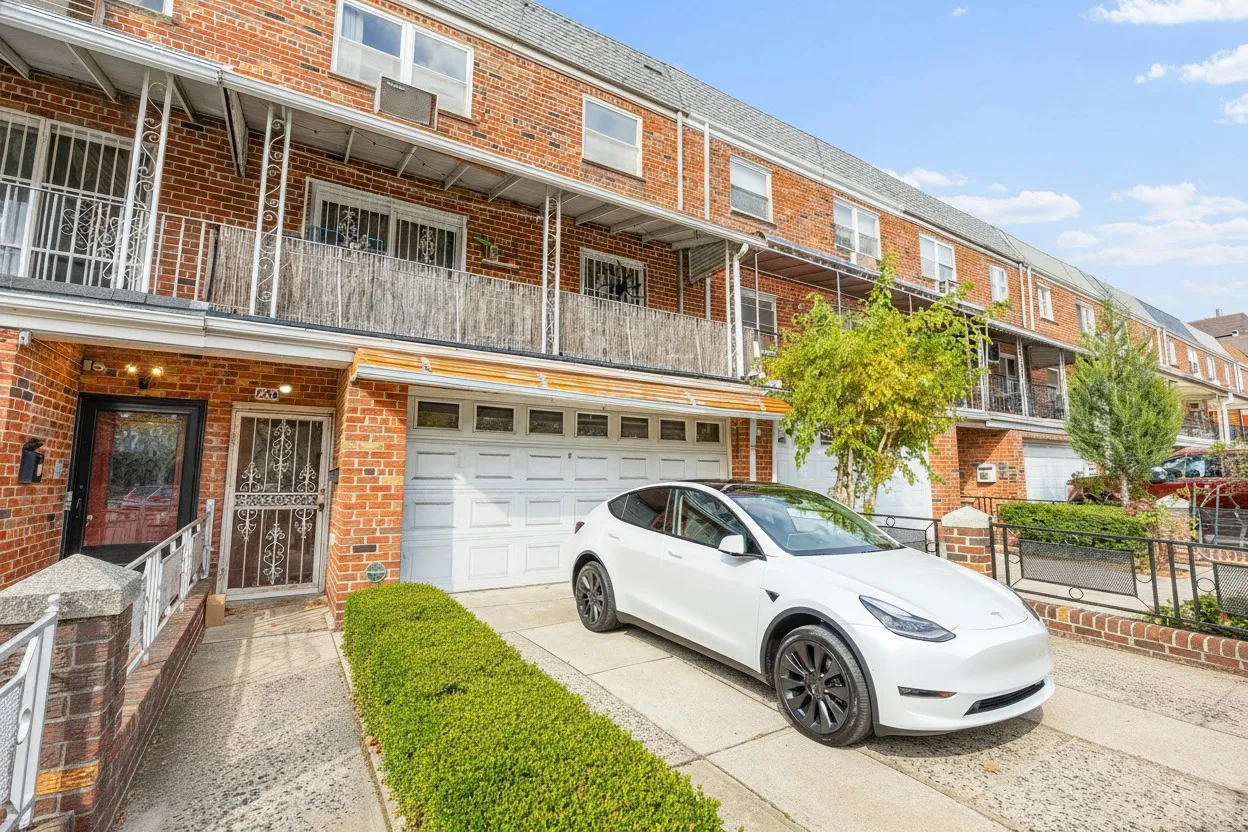 a front view of a house with parking space