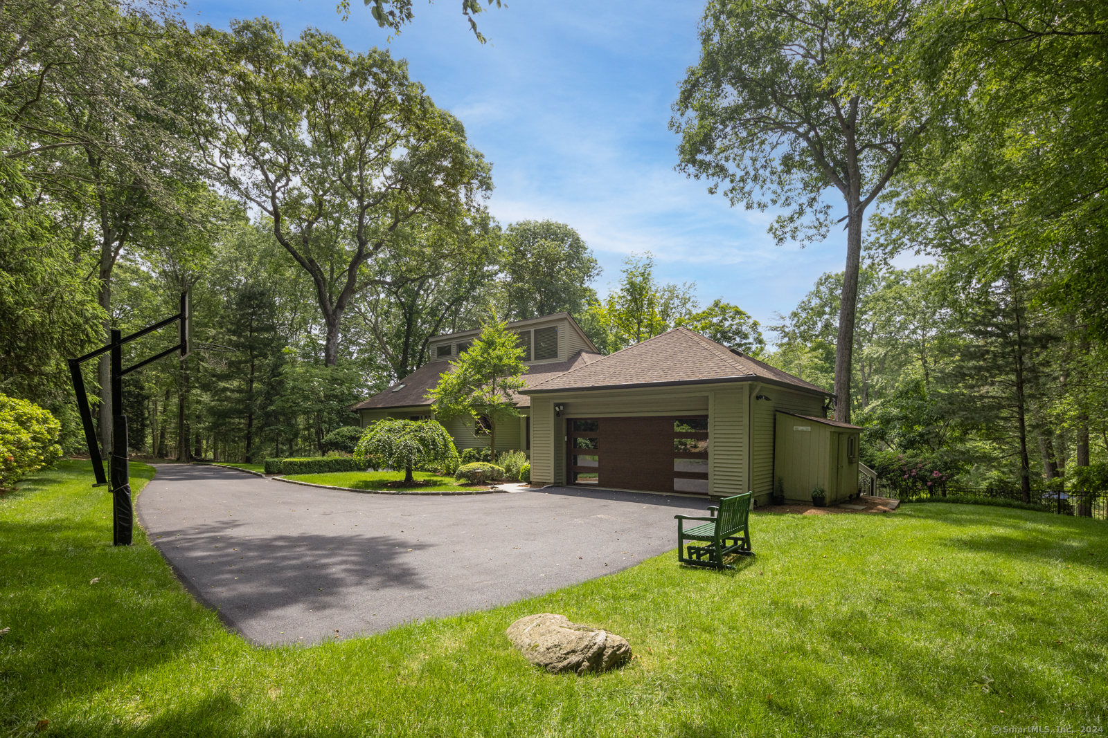 13 Bittersweet Road Weston, CT 06883 - Photo 29 of 35 a front view of a house with garden