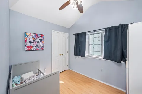 a view of room with window and ceiling fan