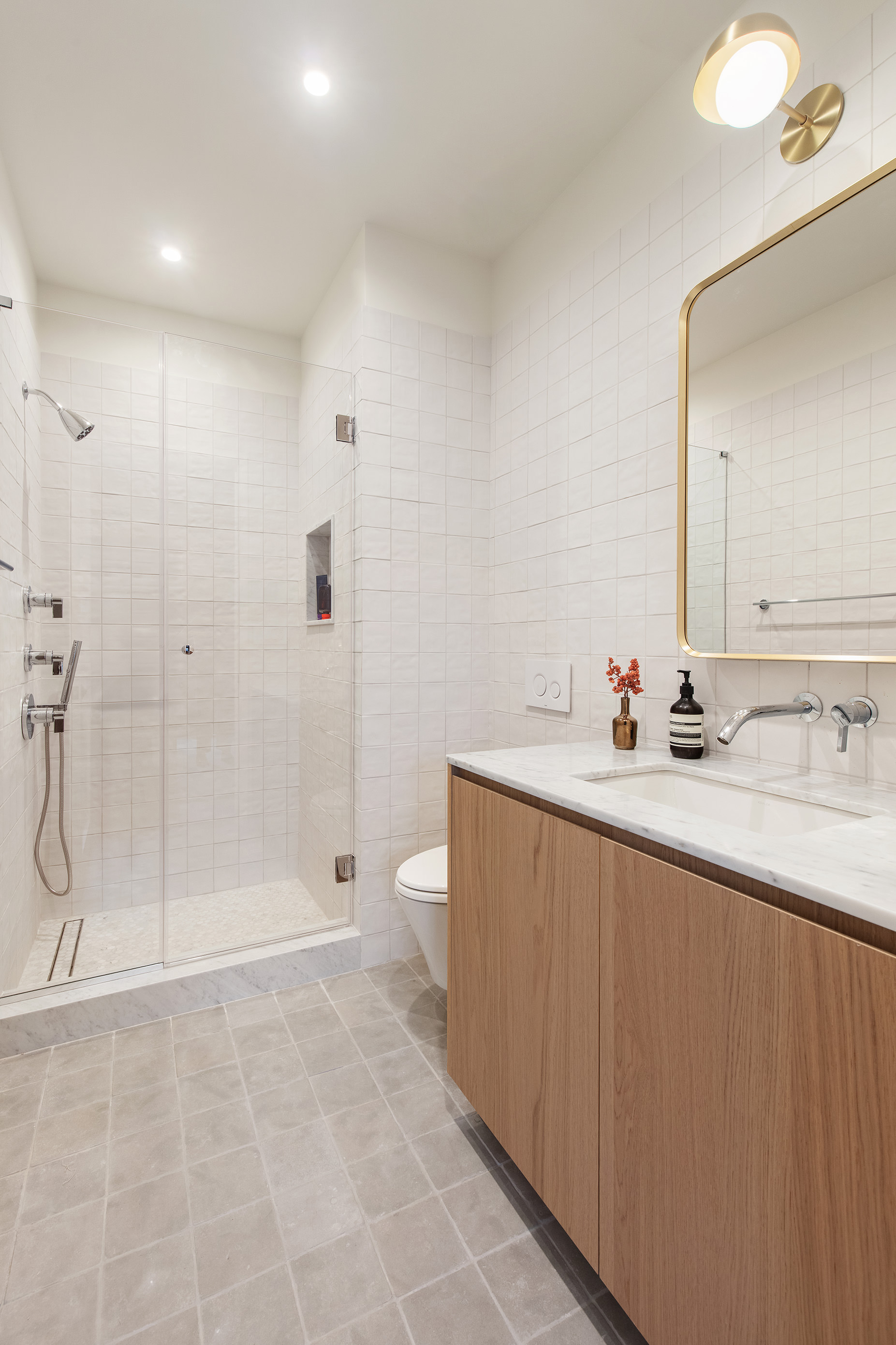 238 Degraw Street, Unit 3 Brooklyn, NY 11231 - Photo 8 of 17 a bathroom with a shower sink and mirror