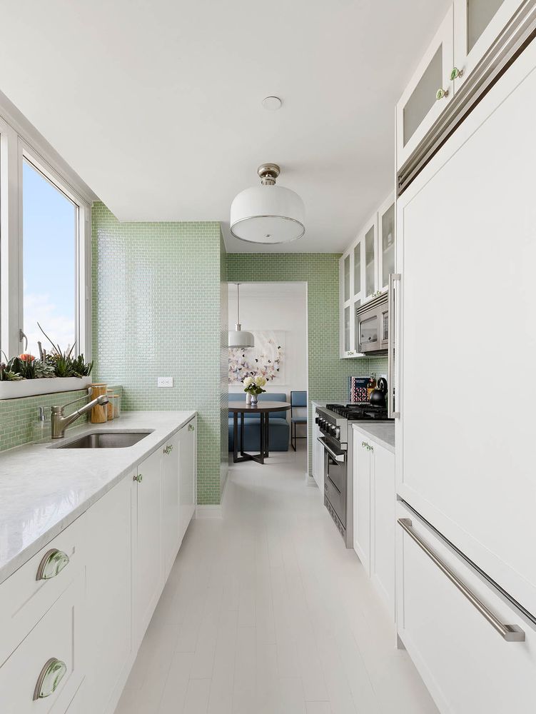 200 West End Avenue, Unit PHA Manhattan, NY 10023 - Photo 8 of 30 a kitchen with stainless steel appliances a sink stove and cabinets
