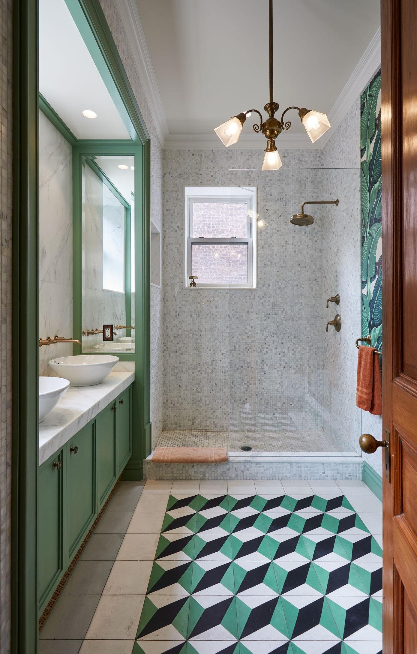 320 Convent Avenue Manhattan, NY 10031 - Photo 11 of 15 a bathroom with a sink a large mirror and a shower