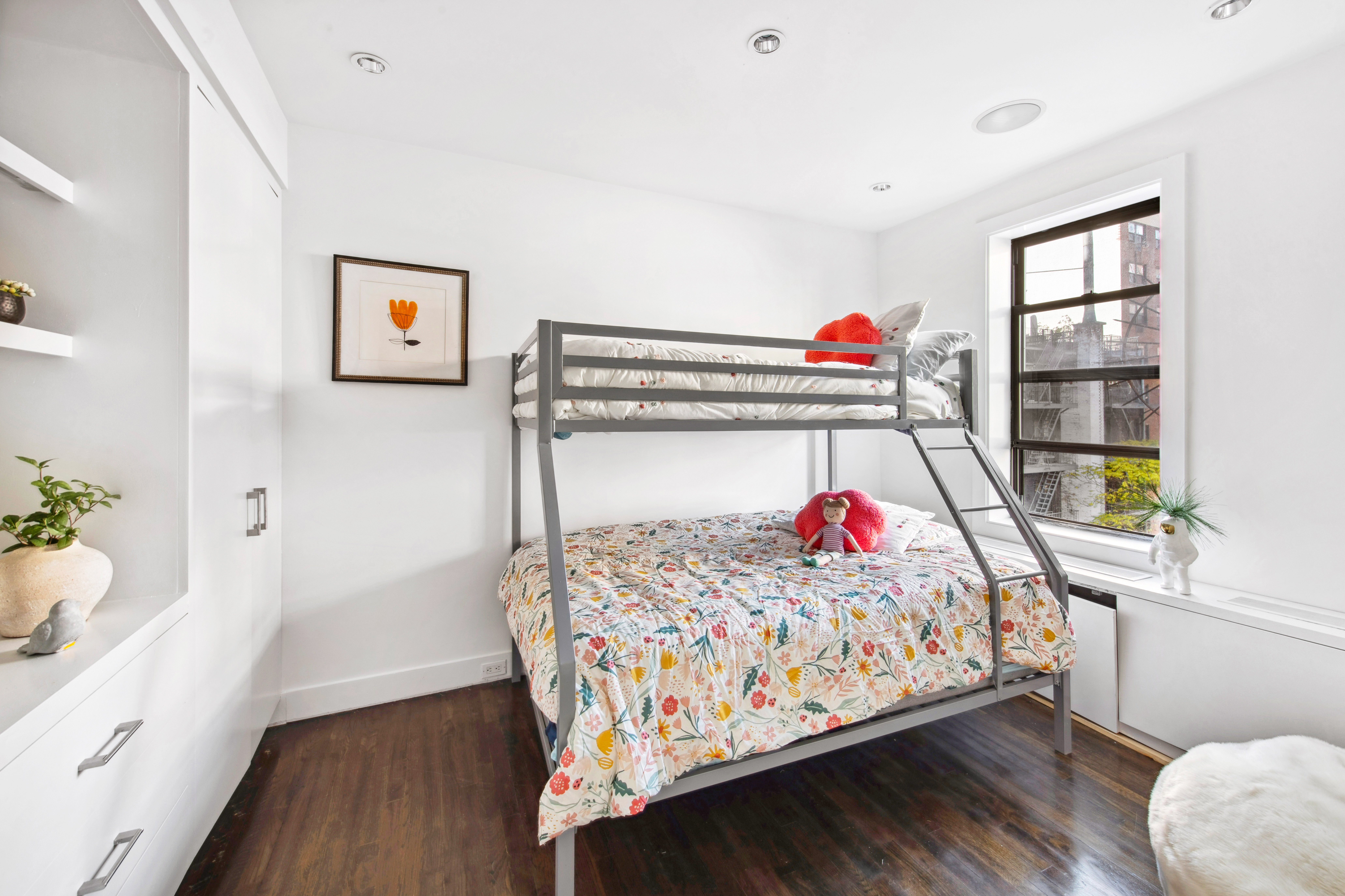 330 East 70th Street, Unit 5AB Manhattan, NY 10021 - Photo 9 of 13 a bedroom with a bed and a painting on the wall