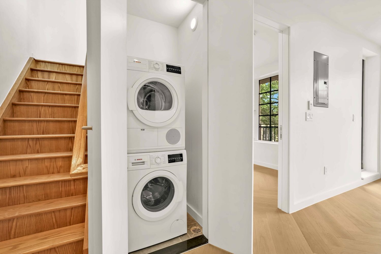 90 Herbert Street, Unit PHB Brooklyn, NY 11222 - Photo 7 of 15 a view of a hallway with washer and dryer