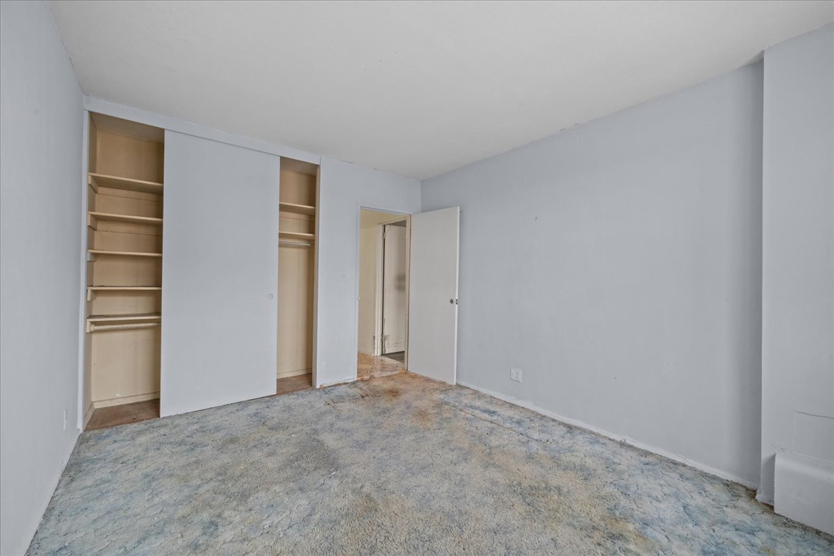 448 Neptune Avenue, Unit 16K Brooklyn, NY 11224 - Photo 9 of 28 a view of an empty room and kitchen space