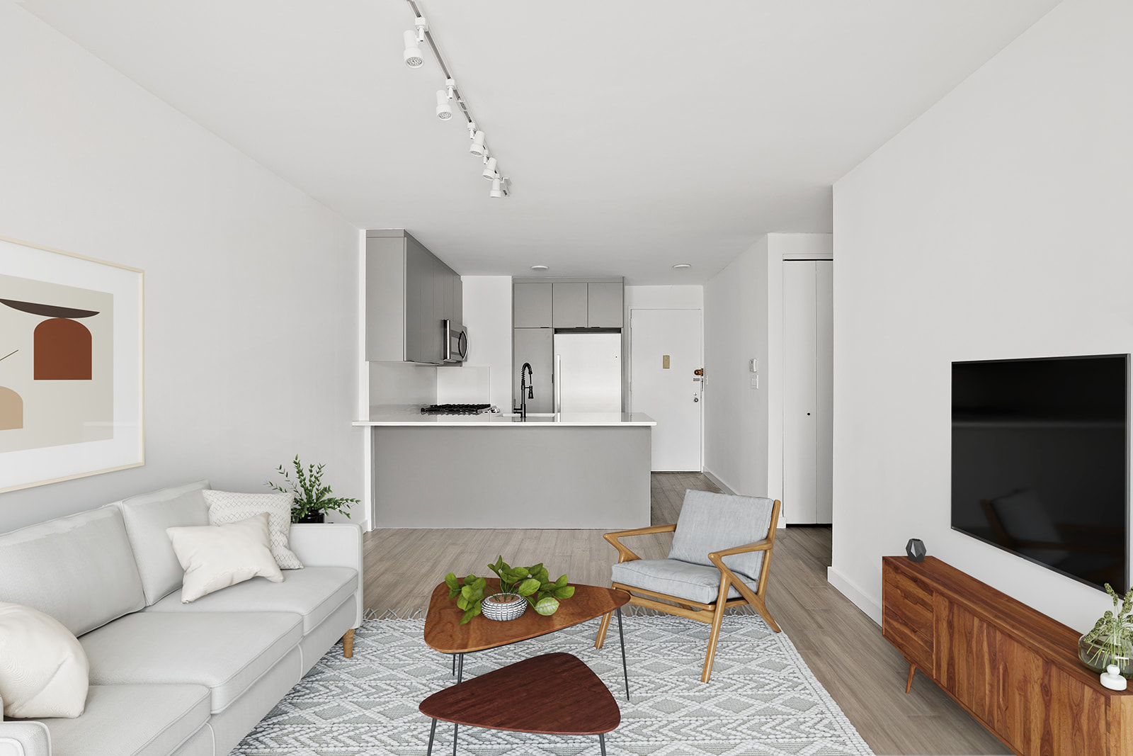270 West 17th Street, Unit 9A Manhattan, NY 10011 - Photo 2 of 6 a living room with furniture and a flat screen tv
