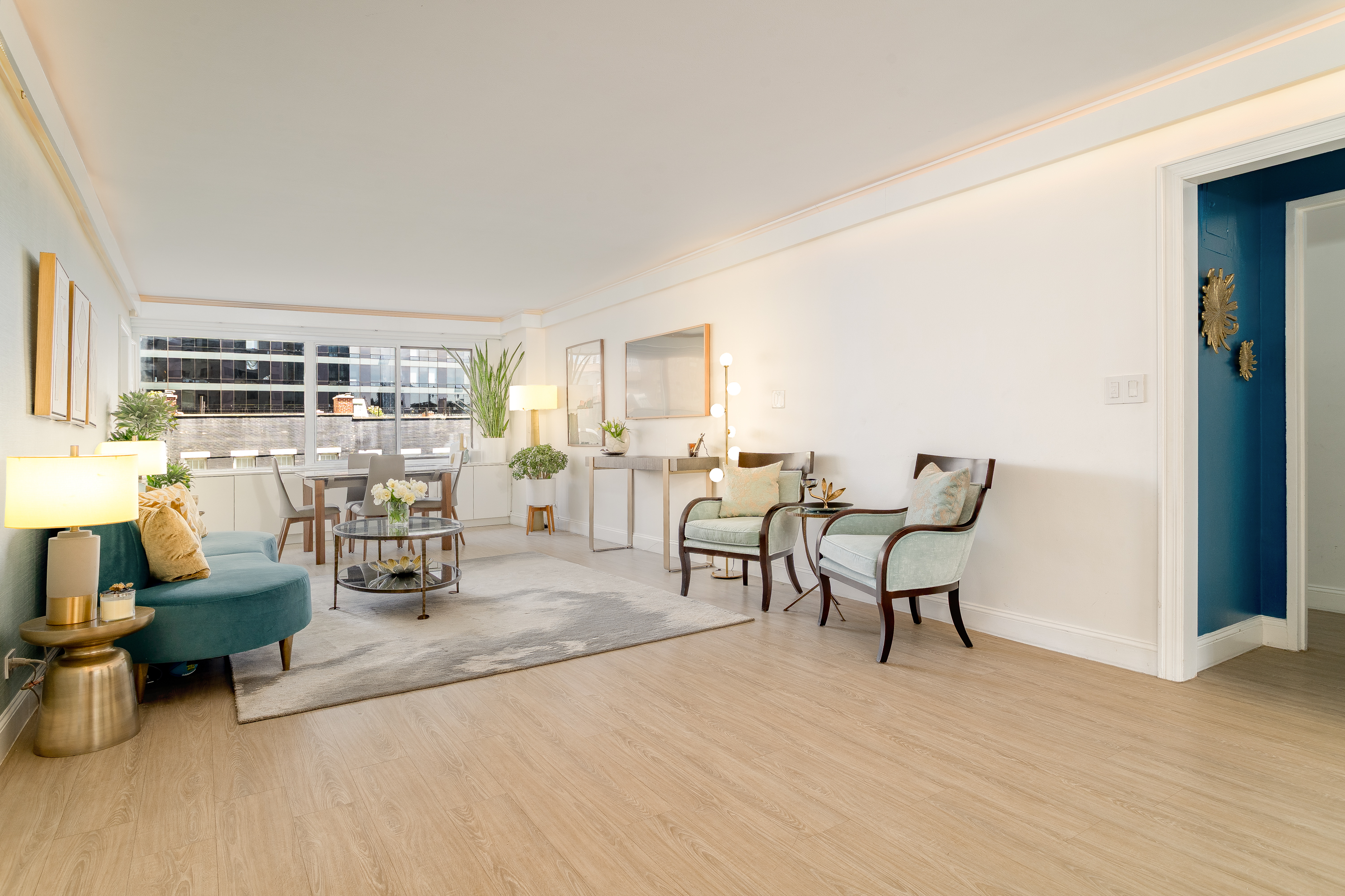 530 East 72nd Street, Unit 7C Manhattan, NY 10021 - Photo 2 of 17 a living room with furniture and a table