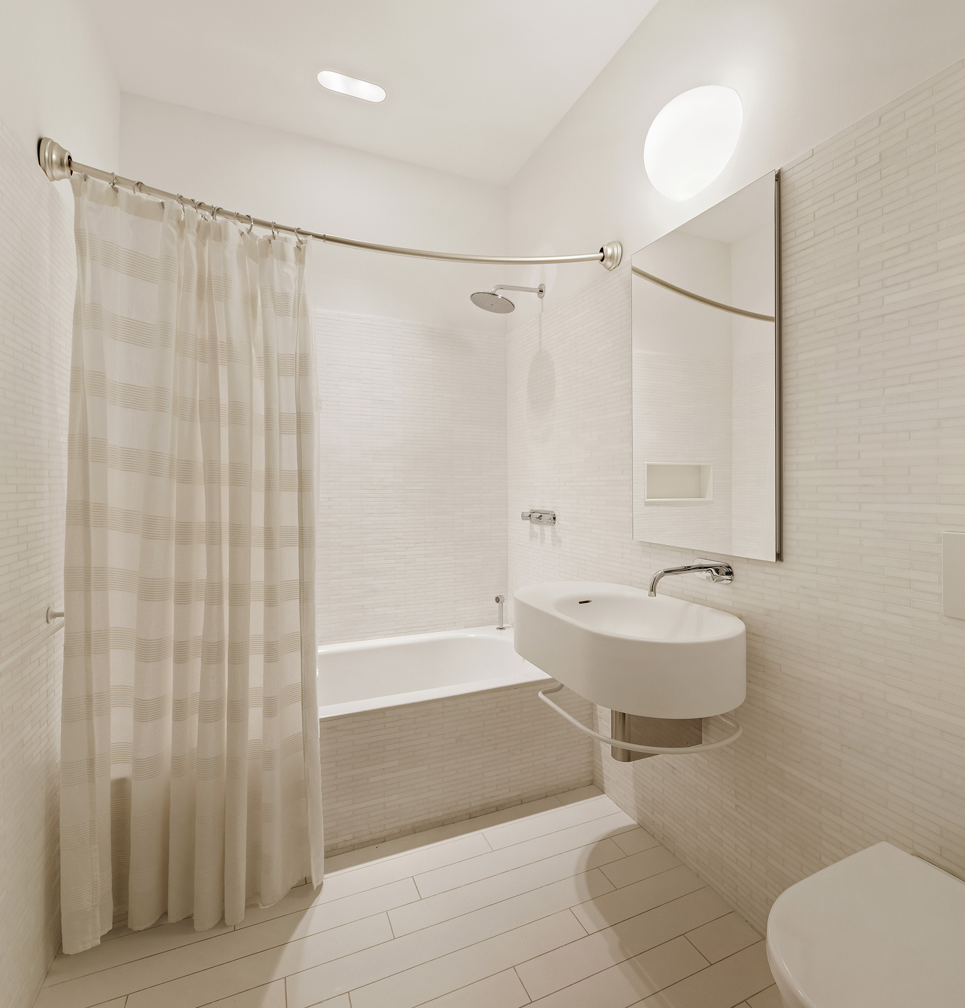 56 Leonard Street, Unit 21AWEST Manhattan, NY 10013 - Photo 8 of 11 a bathroom with a toilet and a shower