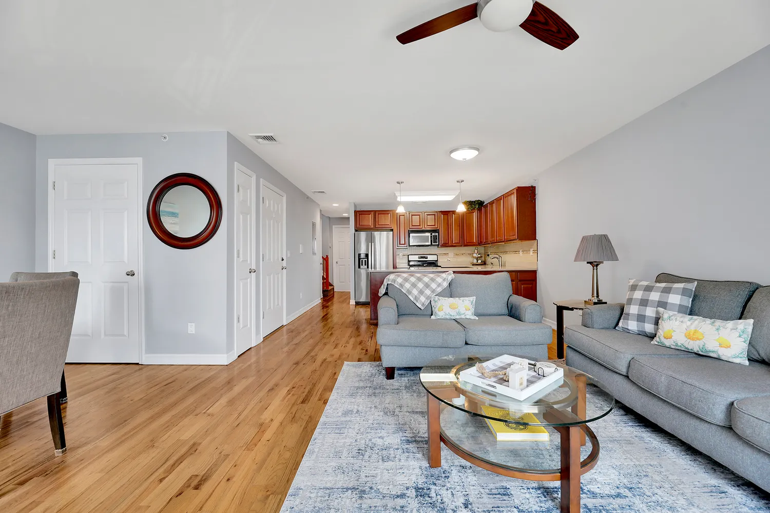 a living room with furniture and a rug