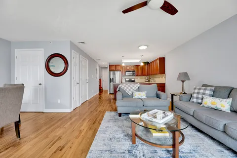 a living room with furniture and a rug