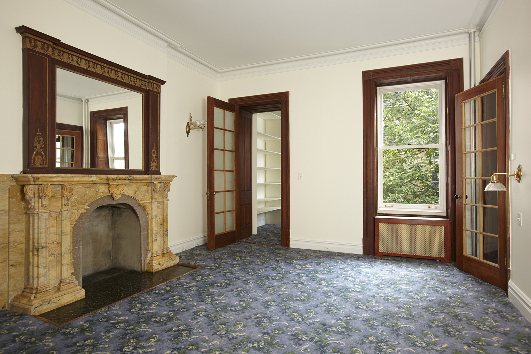 58 West 83rd Street, Unit 4A Manhattan, NY 10024 - Photo 2 of 9 a view of a livingroom with a fireplace and a window