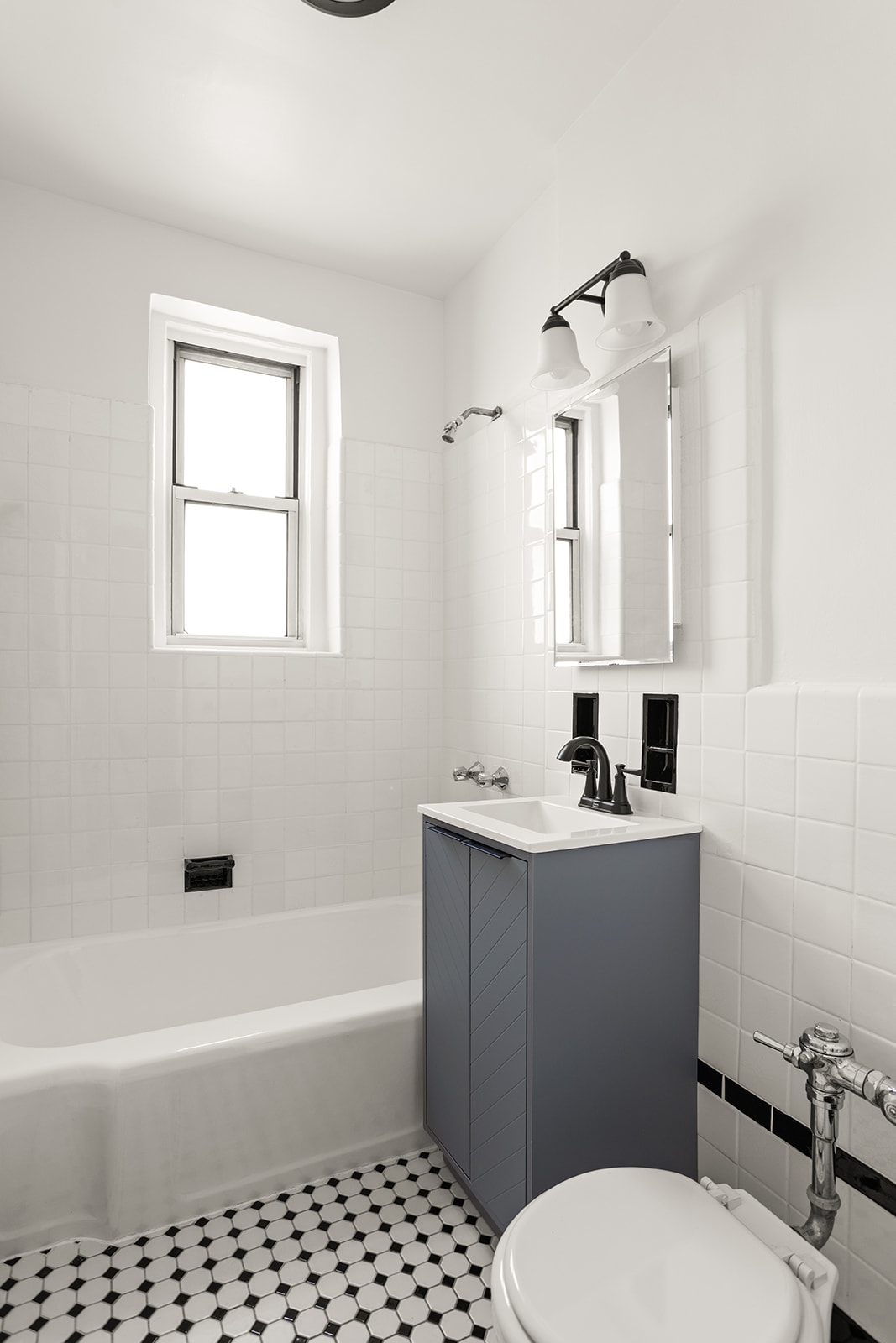 76-12 35th Avenue, Unit 6N Queens, NY 11372 - Photo 9 of 14 a bathroom with a sink toilet and shower