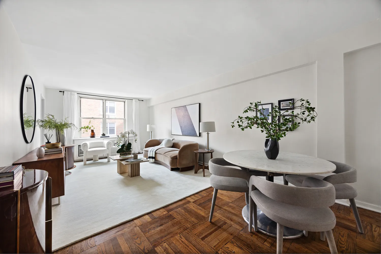 a living room with furniture and a potted plant