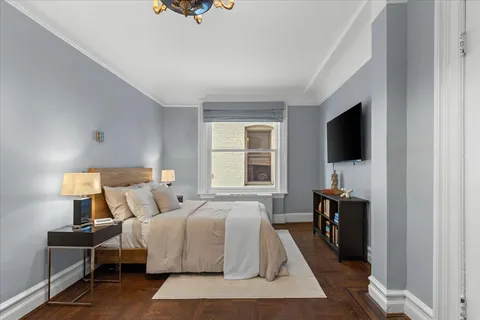 a living room with furniture and a table and a workspace