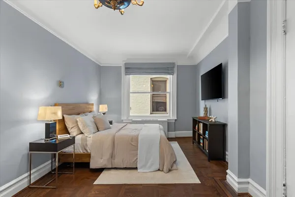 a living room with furniture and a table and a workspace