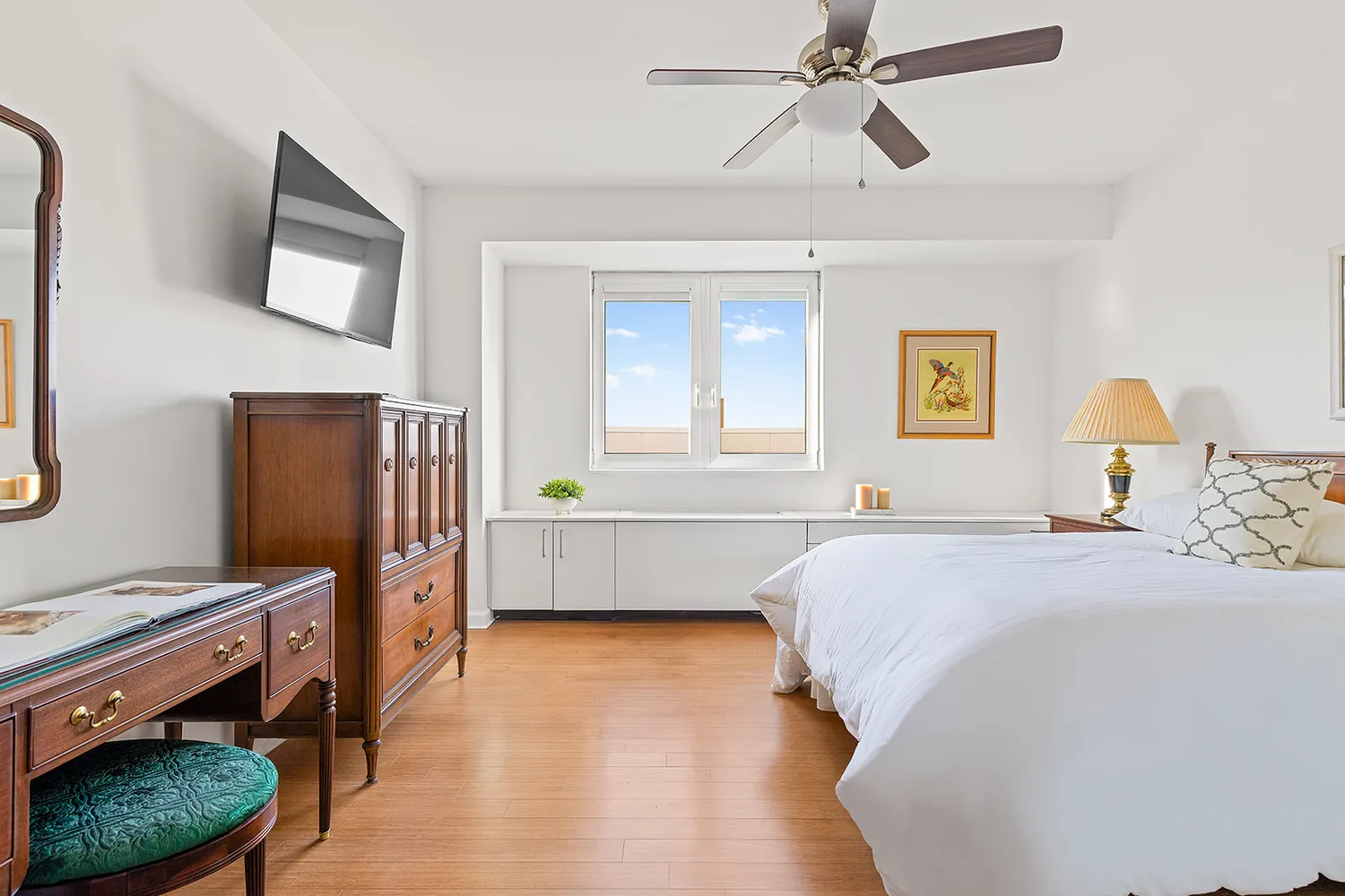 a bedroom with a bed and a dresser