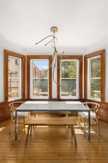a living room filled with furniture and a large window