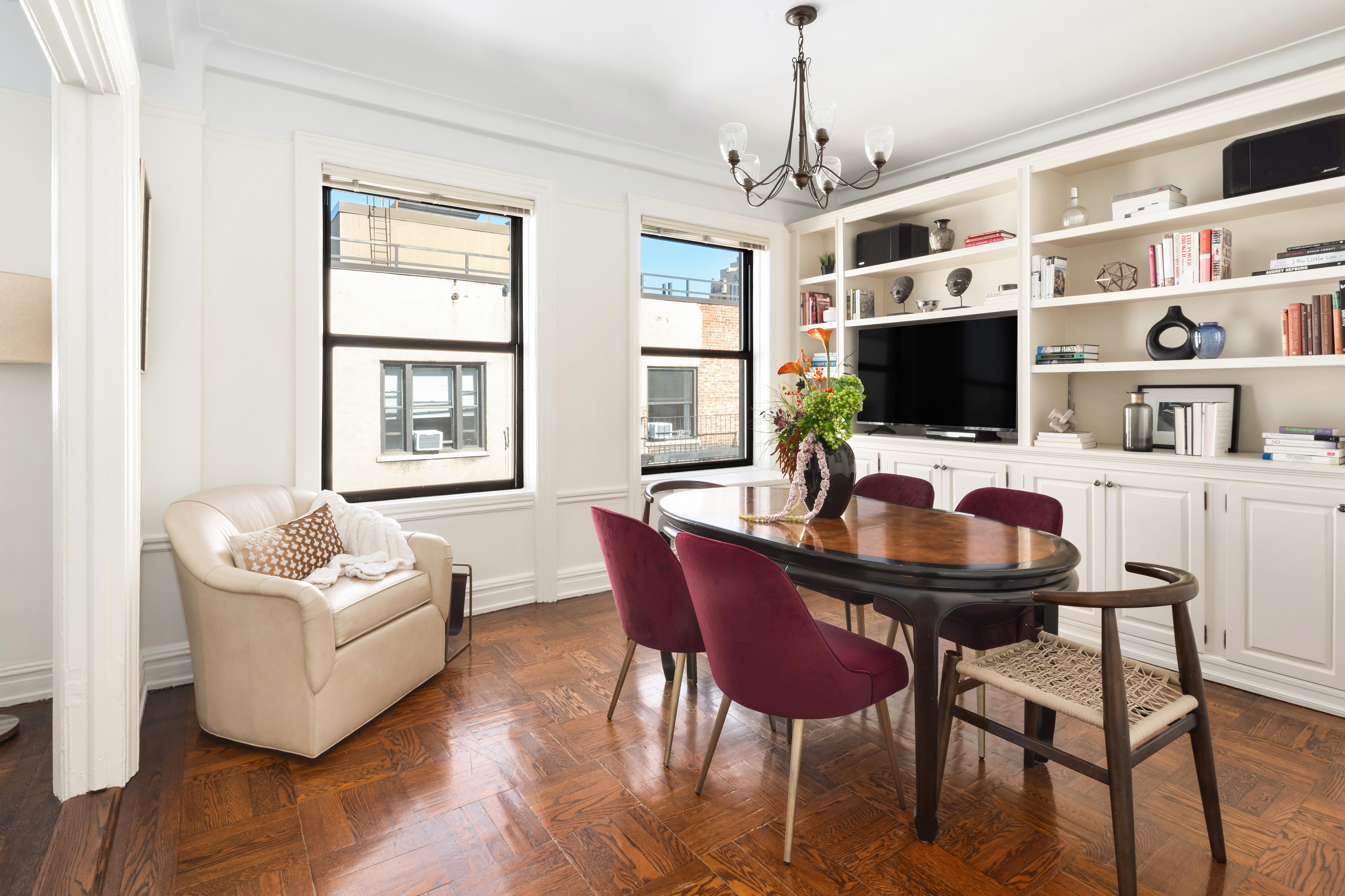 41 West 82nd Street, Unit 9D Manhattan, NY 10024 - Photo 4 of 15 a workspace with furniture wooden floor and a window