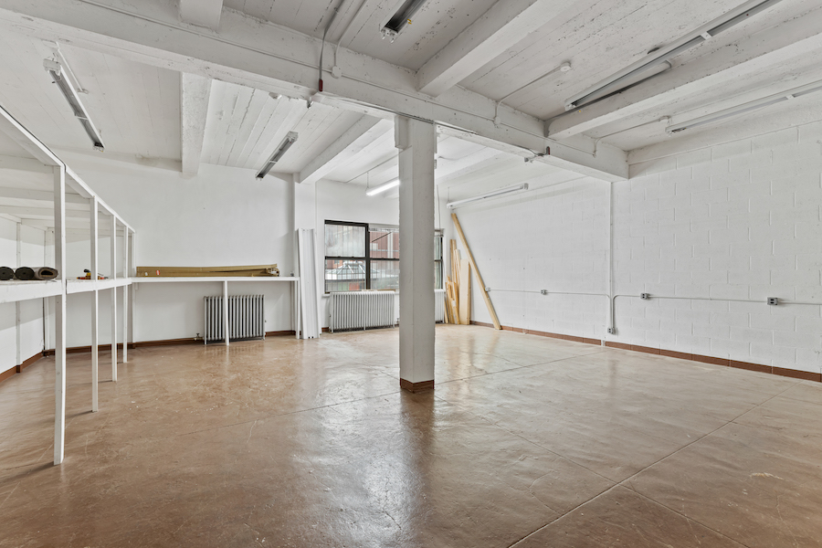 315 East 91st Street, Unit 6C Manhattan, NY 10128 - Photo 7 of 8 a view of an empty room with stairs