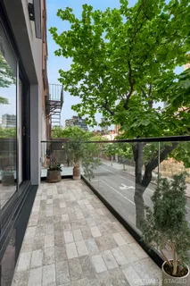 a view of a street with an outdoor seating