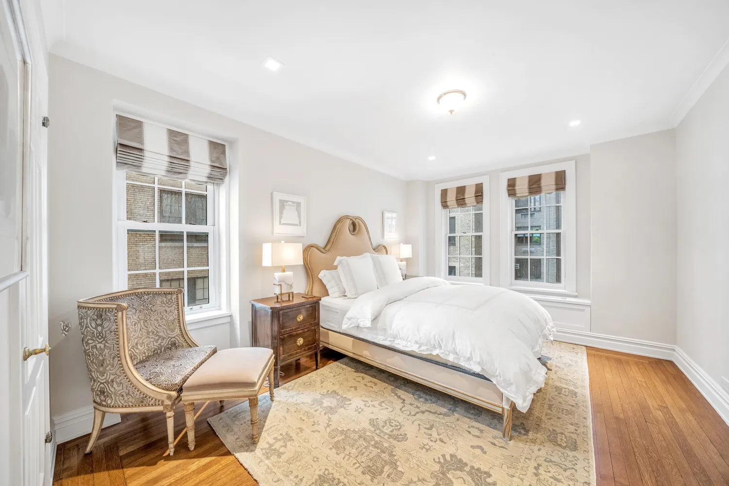 a bedroom with a bed a table and chair