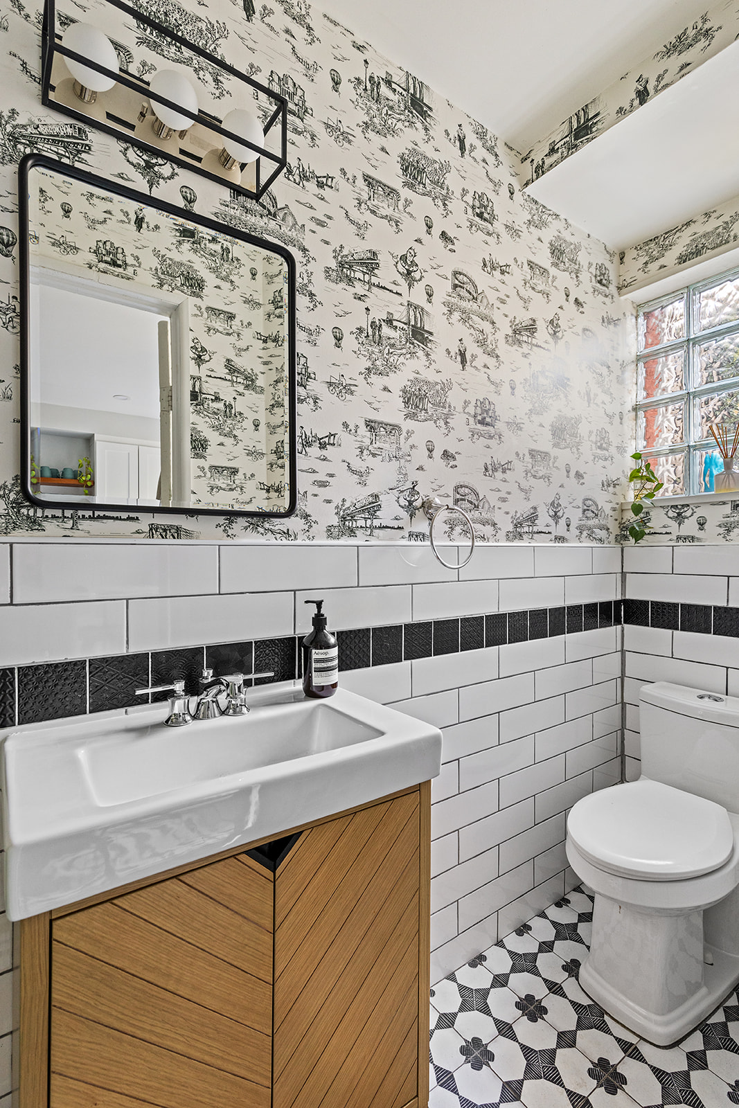 331 A Stuyvesant Avenue Brooklyn, NY 11233 - Photo 18 of 21 a bathroom with a sink a toilet and a mirror