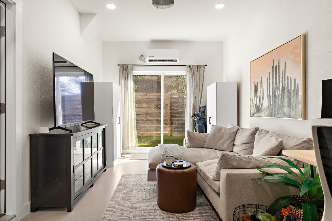 1402 Singleton Avenue, Unit B Austin, TX 78702 - Photo 10 of 26 a living room with furniture and a large window