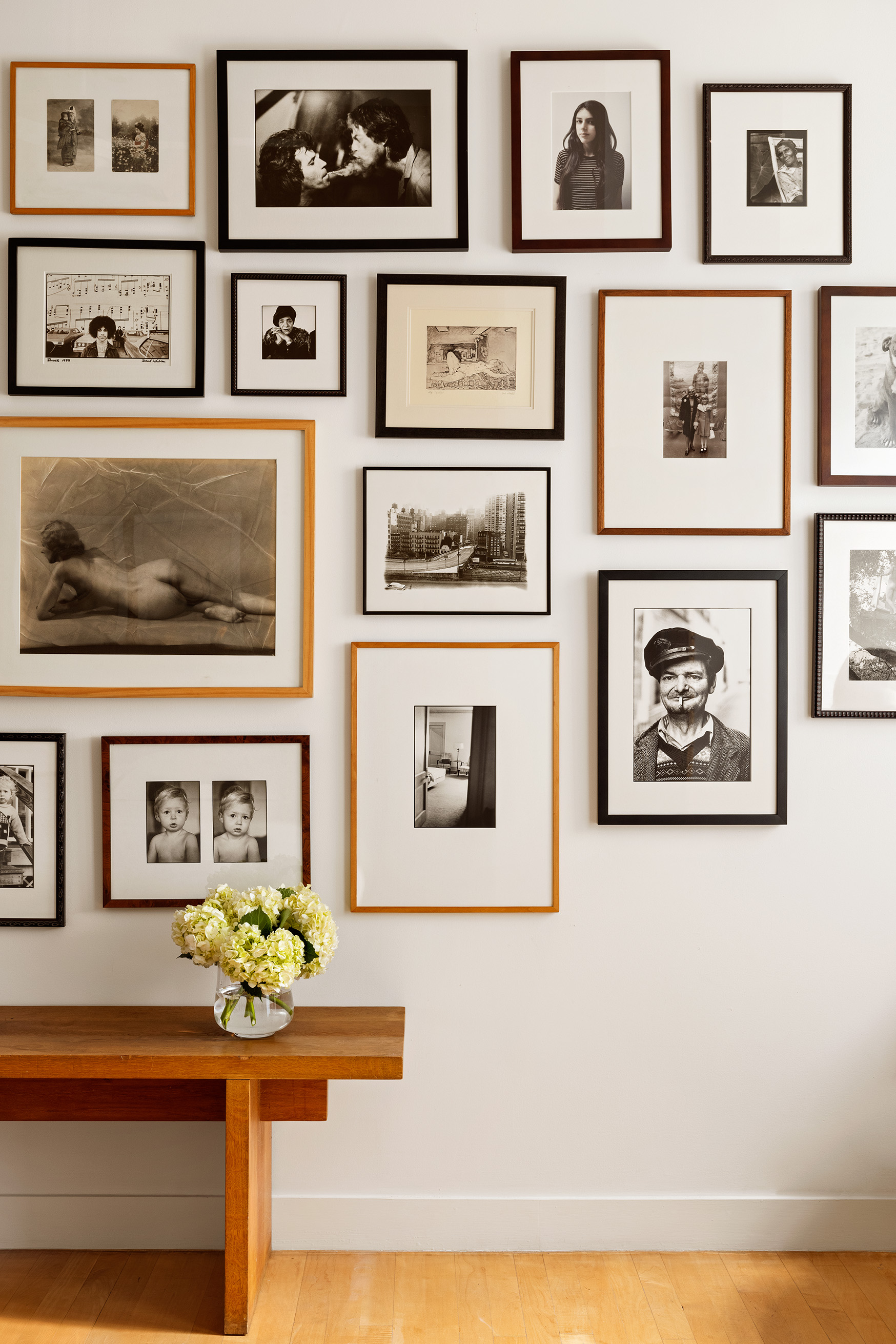 32 West 20th Street, Unit 9B Manhattan, NY 10011 - Photo 9 of 16 a view of a hallway with a painting on the wall and a potted plant