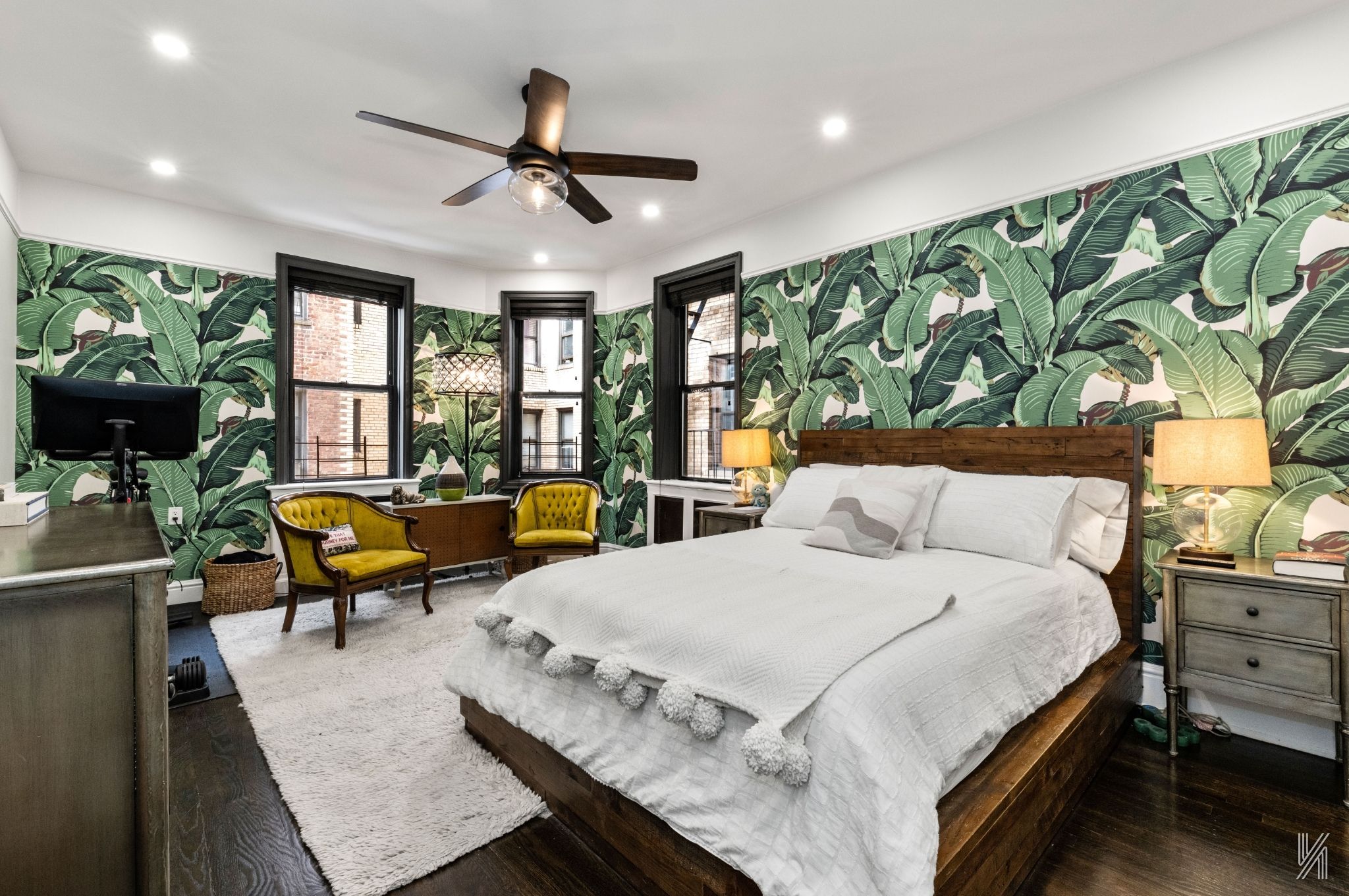 35-06 88th Street, Unit 3G Queens, NY 11372 - Photo 11 of 20 a bedroom with a bed a couch and a potted plant