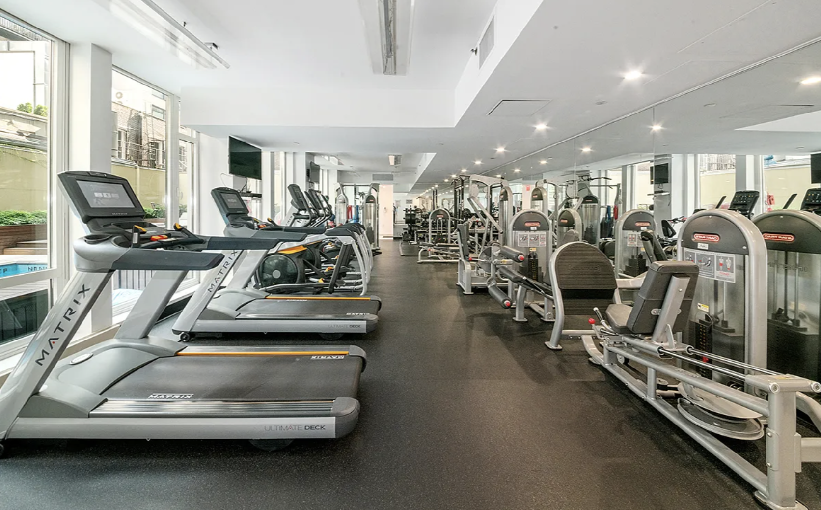 133 West 22nd Street, Unit 7H Manhattan, NY 10011 - Photo 18 of 21 a view of a room with gym equipment