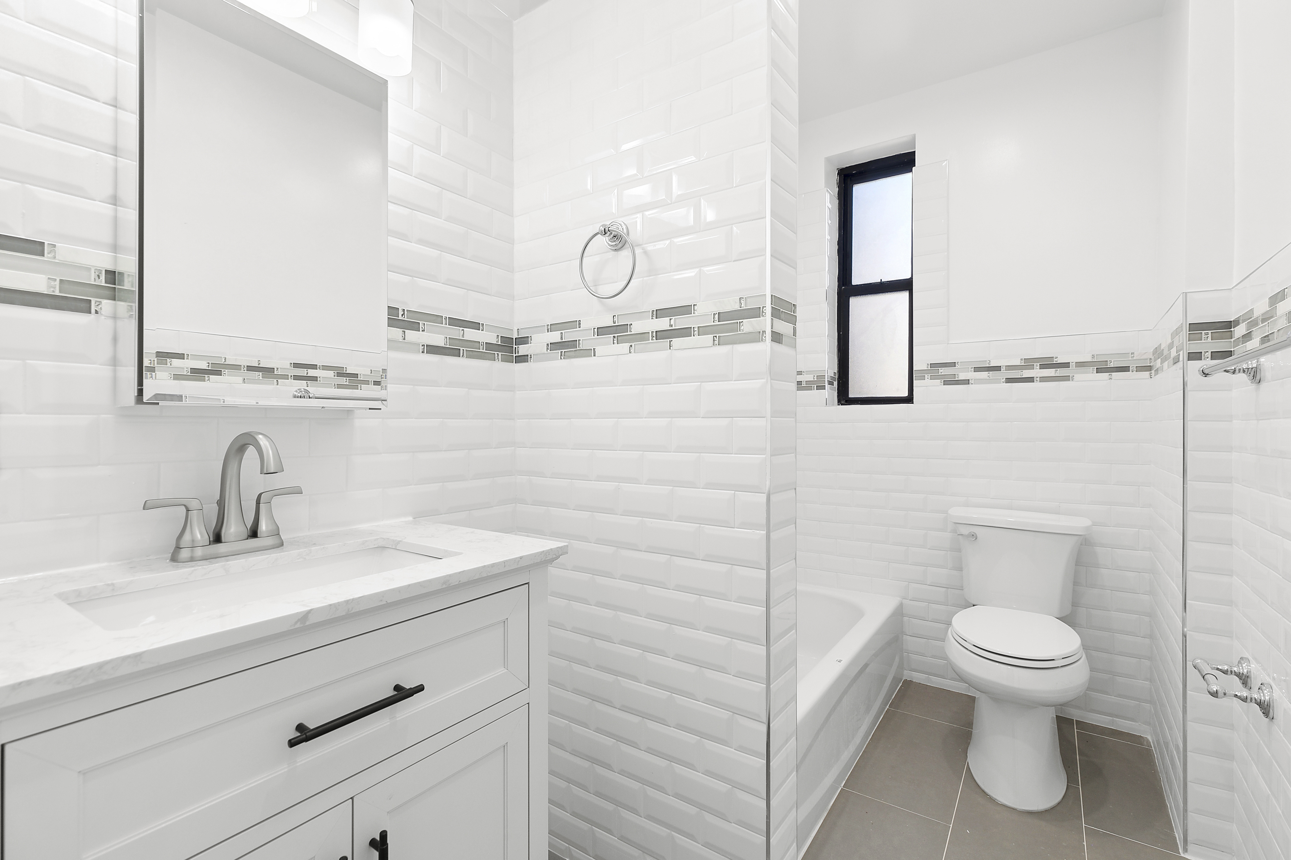 159-34 Riverside Drive West, Unit 7L90 Manhattan, NY 10032 - Photo 11 of 22 a bathroom with a toilet sink and mirror