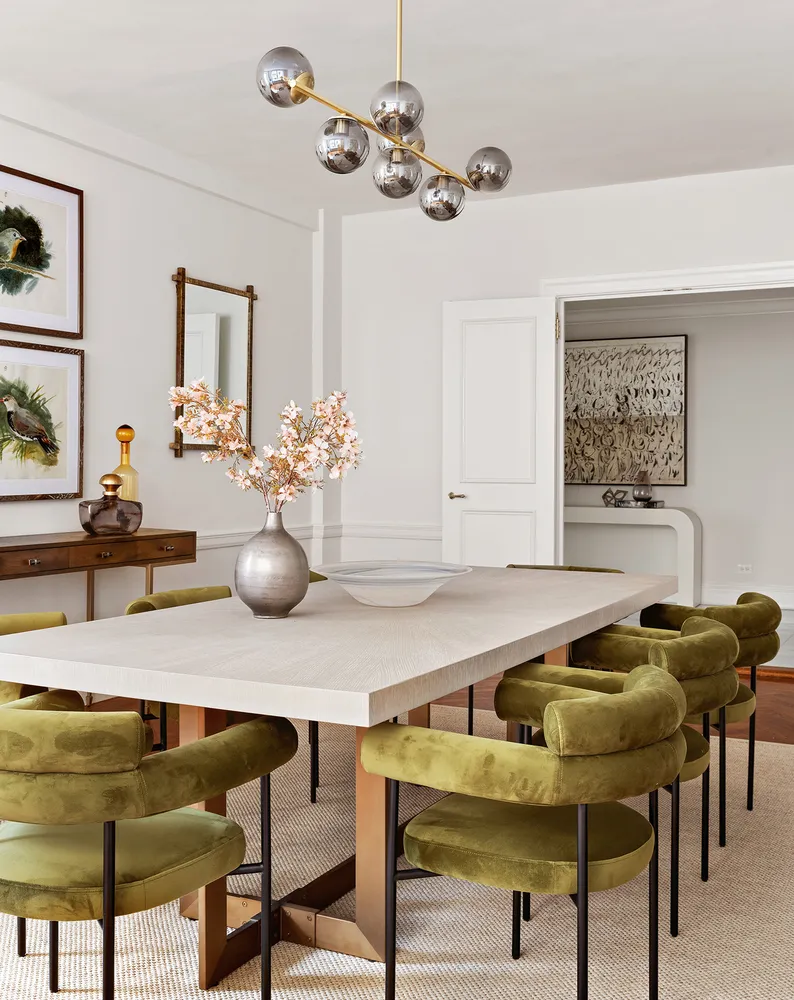a living room with furniture and chandelier