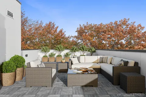 a outdoor living space with furniture and city view