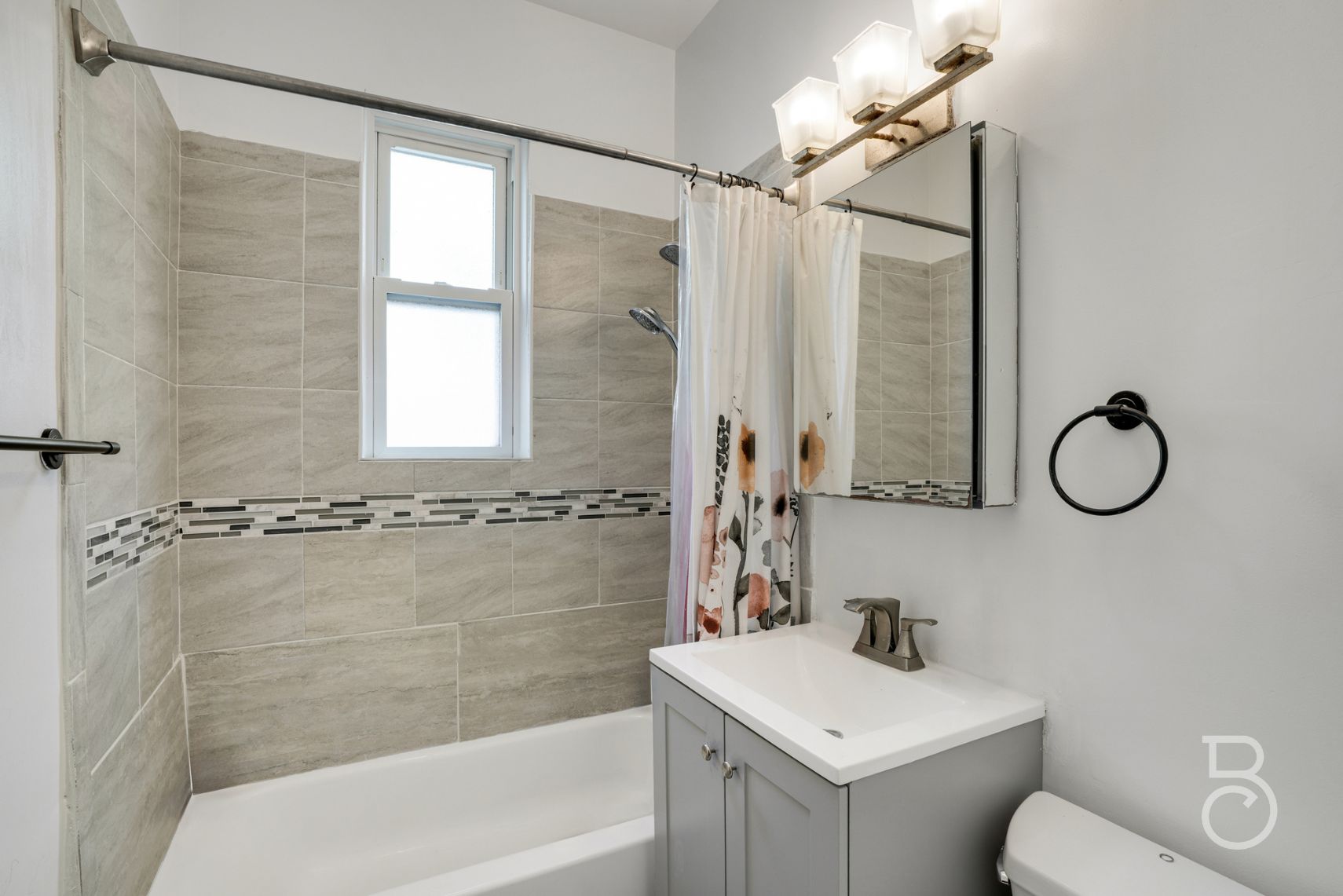 37-09 20th Road Queens, NY 11105 - Photo 5 of 16 a bathroom with a sink toilet and shower