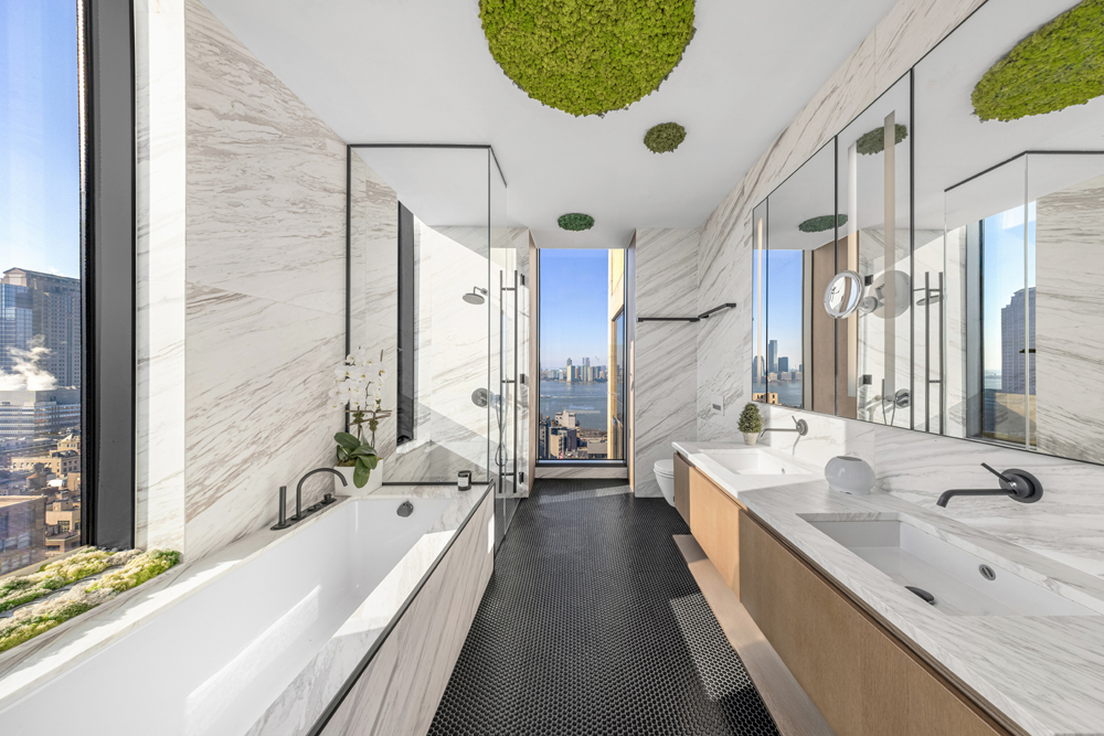 570 Broome Street, Unit PHB Manhattan, NY 10013 - Photo 10 of 23 a bathroom with a granite countertop sink mirror bathtub and shower