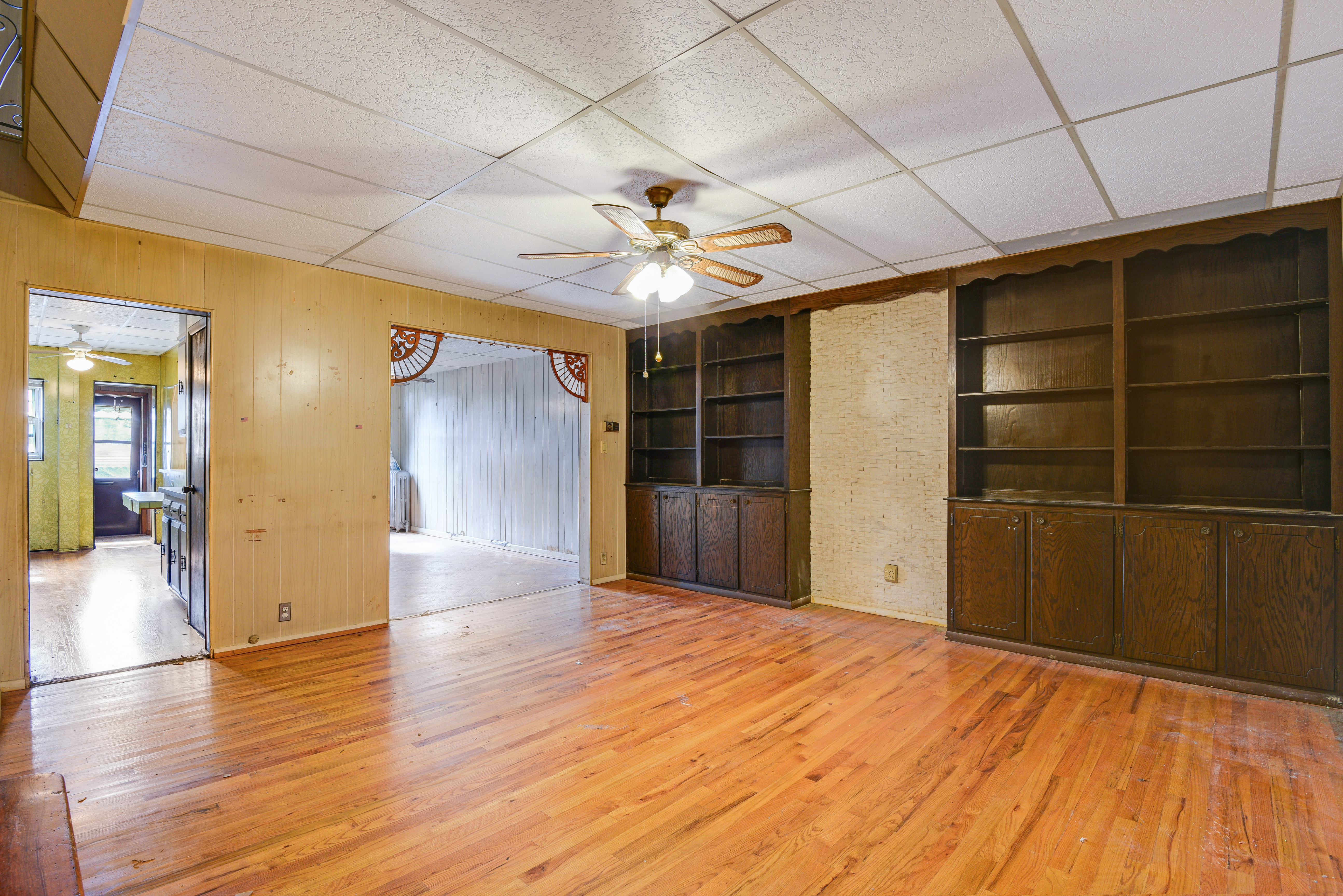 75-36 60th Lane Queens, NY 11385 - Photo 4 of 18 a view of a livingroom with a chandelier