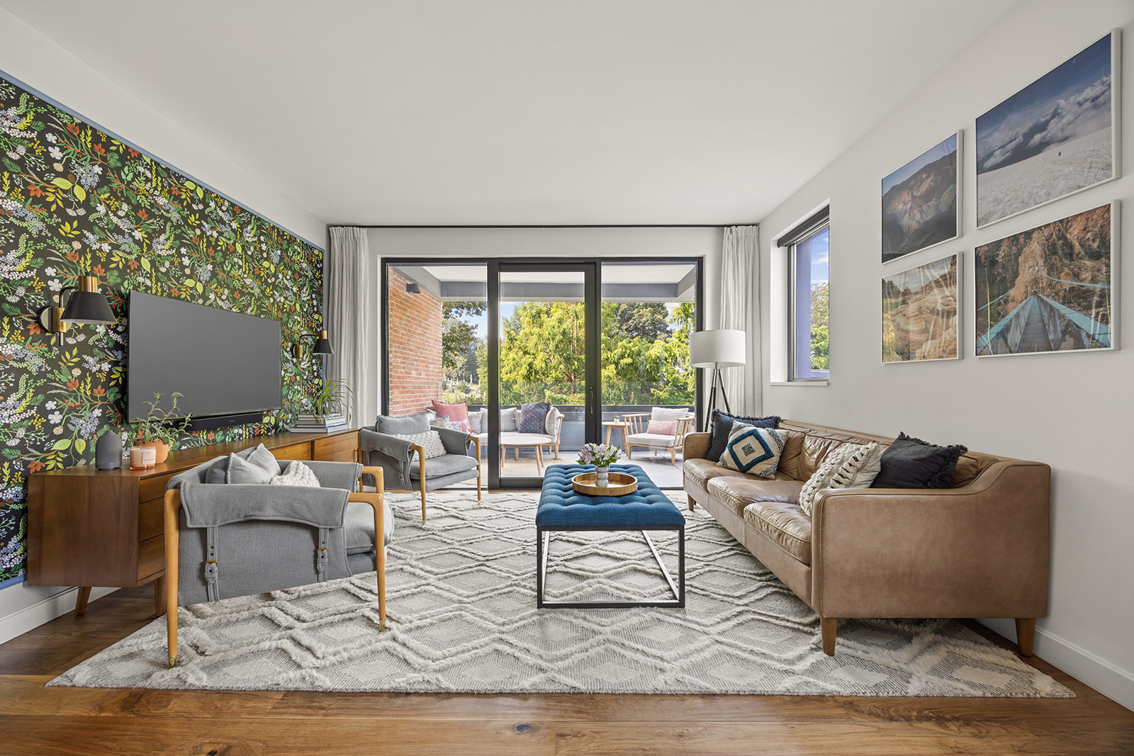 a living room with furniture and a flat screen tv