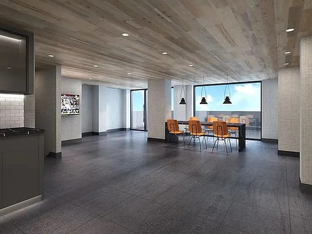 41-21 23rd Street, Unit 6C Queens, NY 11101 - Photo 7 of 10 a living room with furniture and chandelier