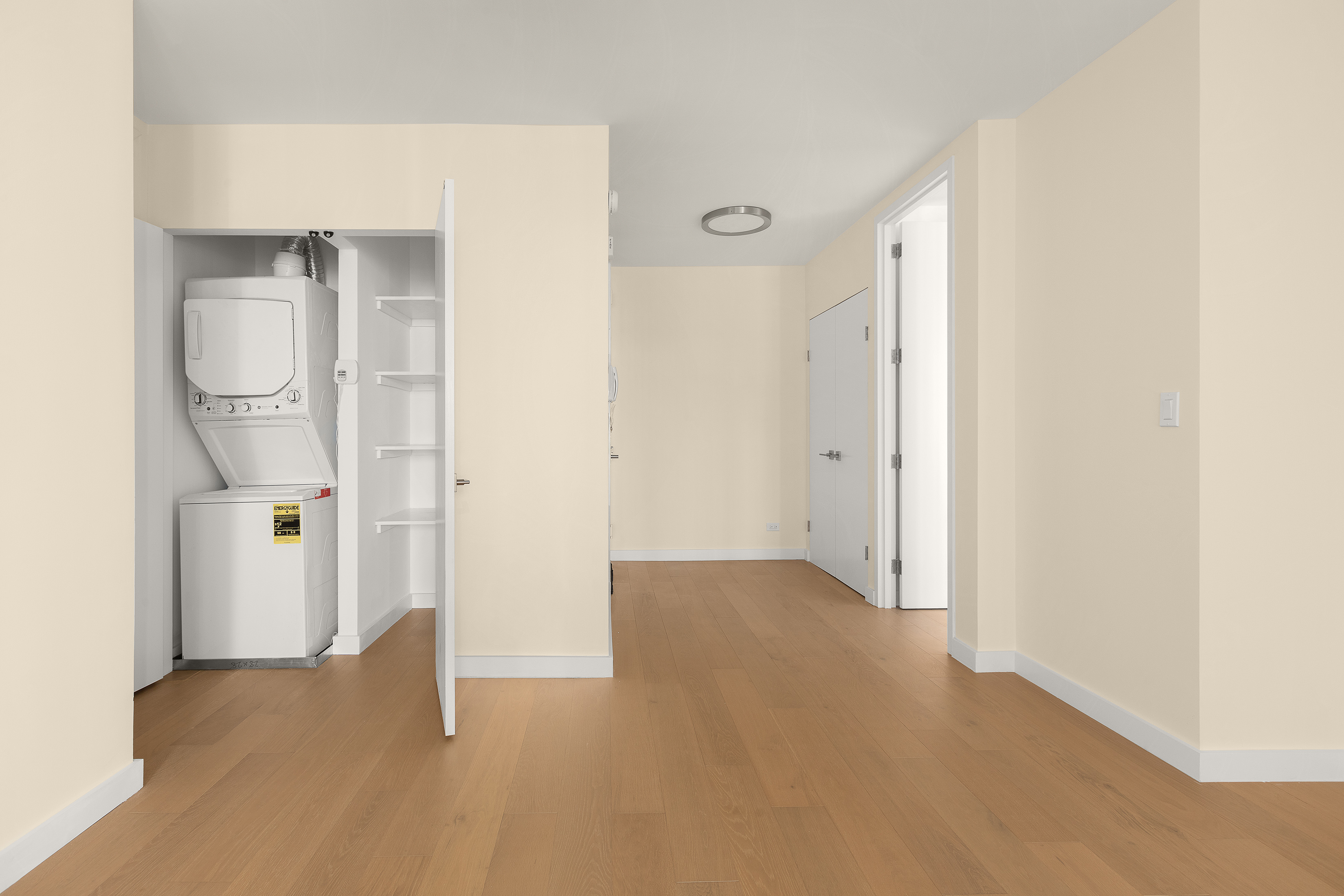 161 West 61st Street, Unit 5C Manhattan, NY 10023 - Photo 13 of 30 a view of an empty room with wooden floor