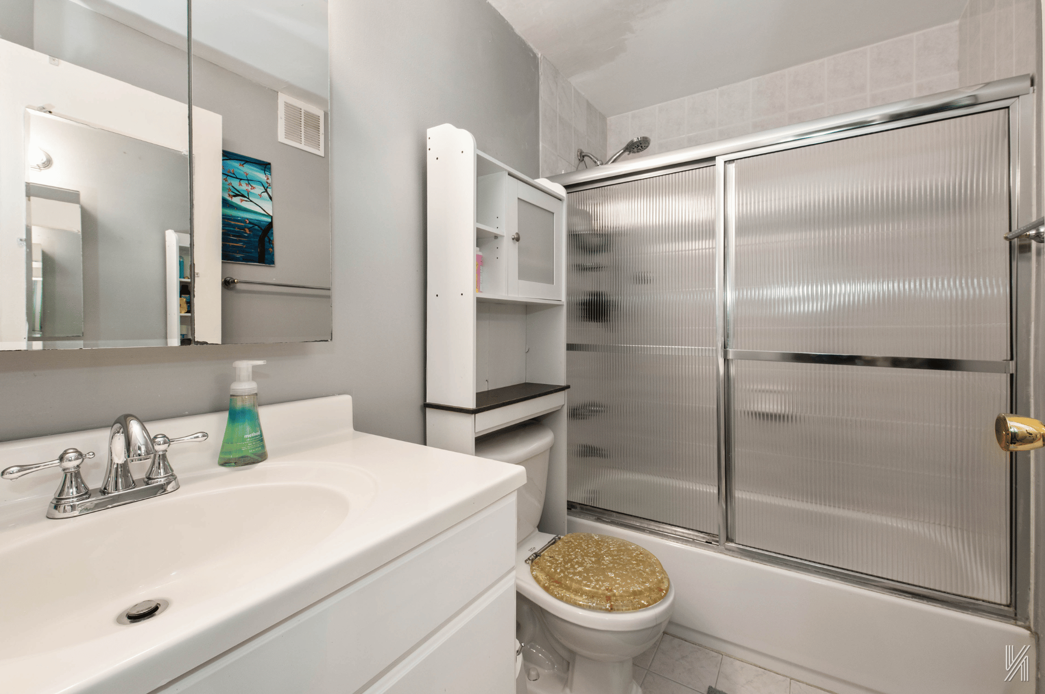 1148 East 73rd Street Brooklyn, NY 11234 - Photo 10 of 15 a bathroom with a sink toilet and shower