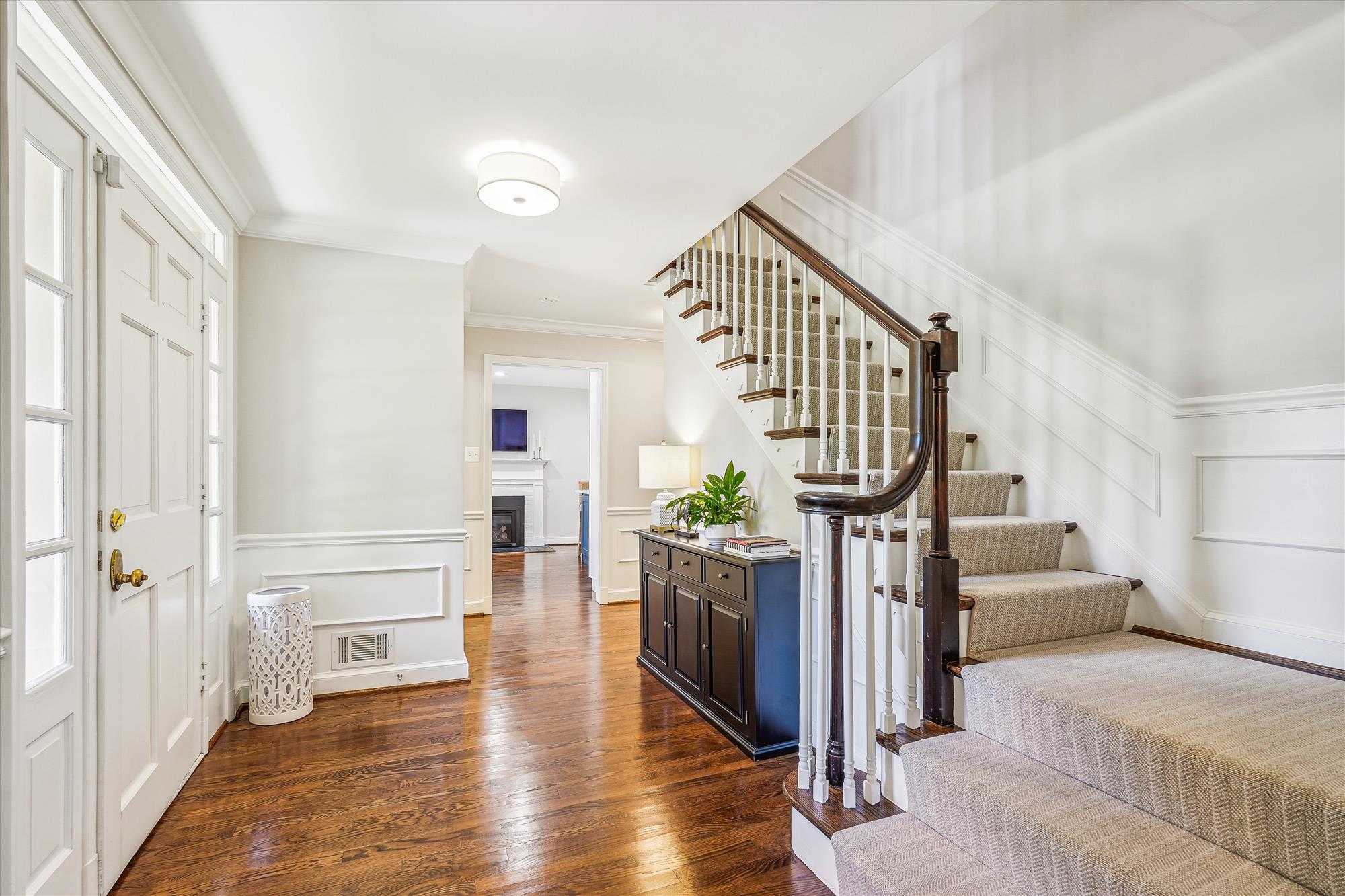 9904 Carter Road Bethesda, MD 20817 - Photo 3 of 41 a living room with fireplace furniture and a wooden floor