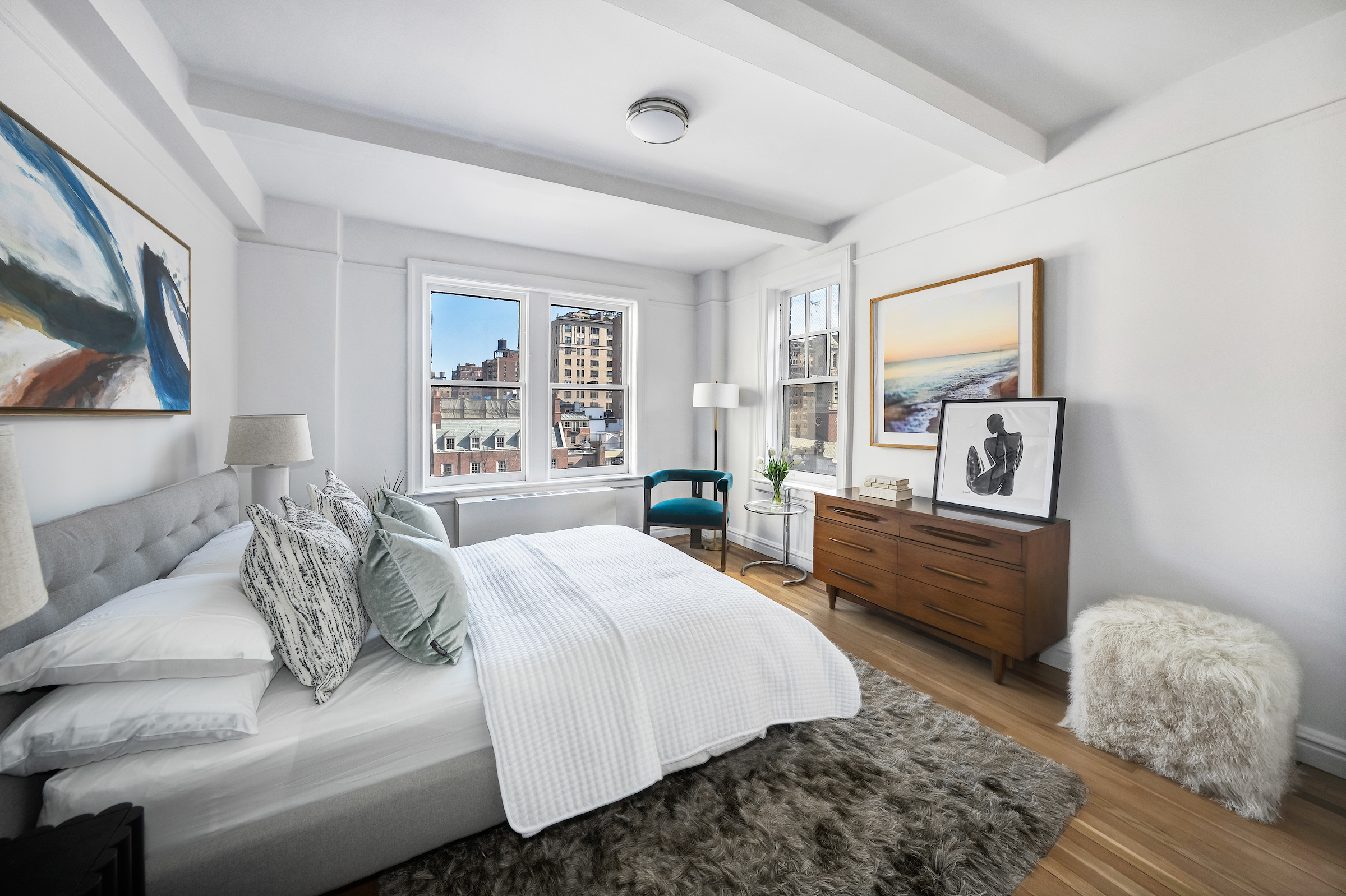 51 East 90th Street, Unit 8D Manhattan, NY 10128 - Photo 6 of 10 a bedroom with a bed and wooden floor