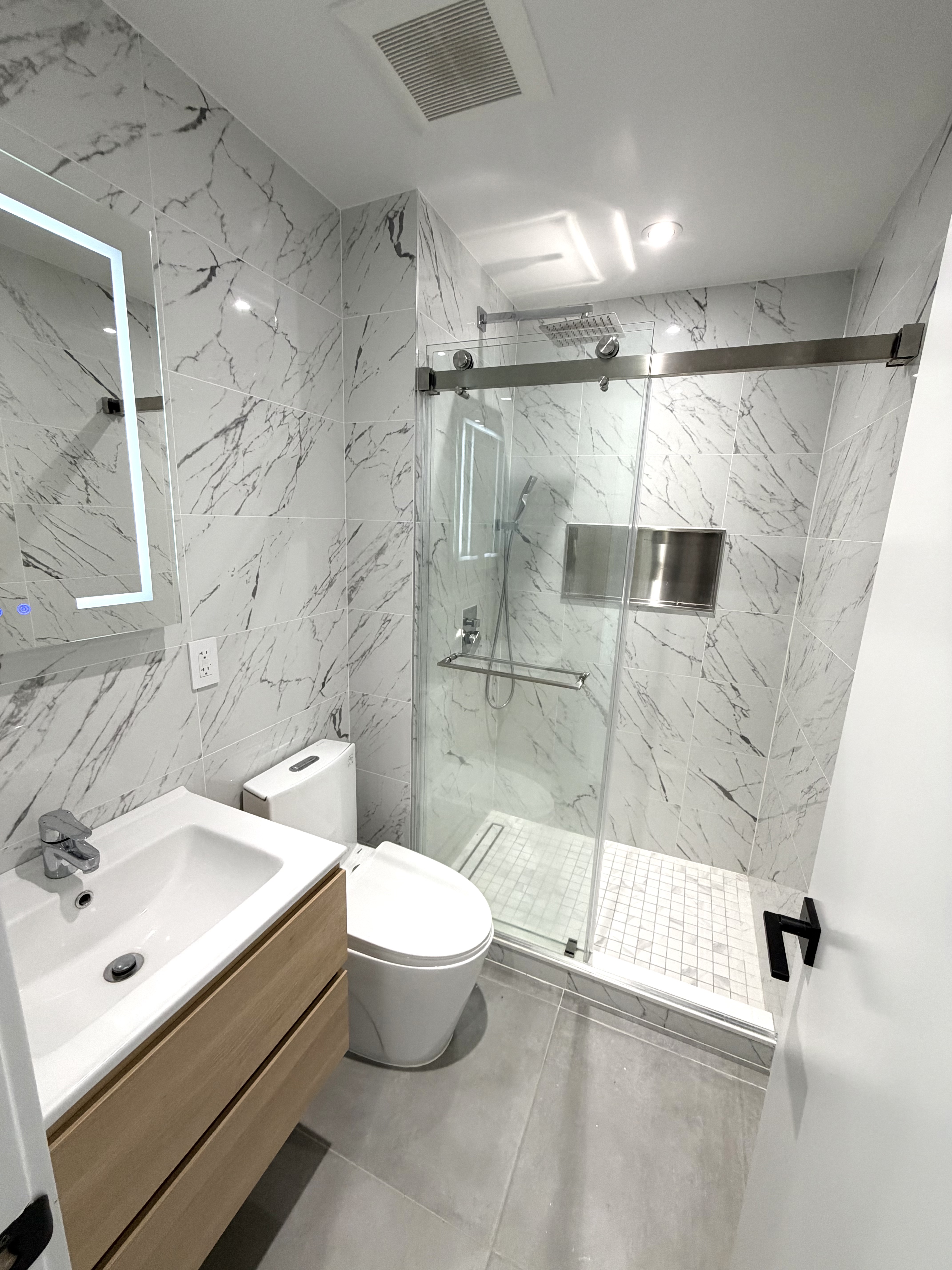 845 55th Street, Unit 3B Brooklyn, NY 11220 - Photo 5 of 6 a bathroom with a sink toilet and shower