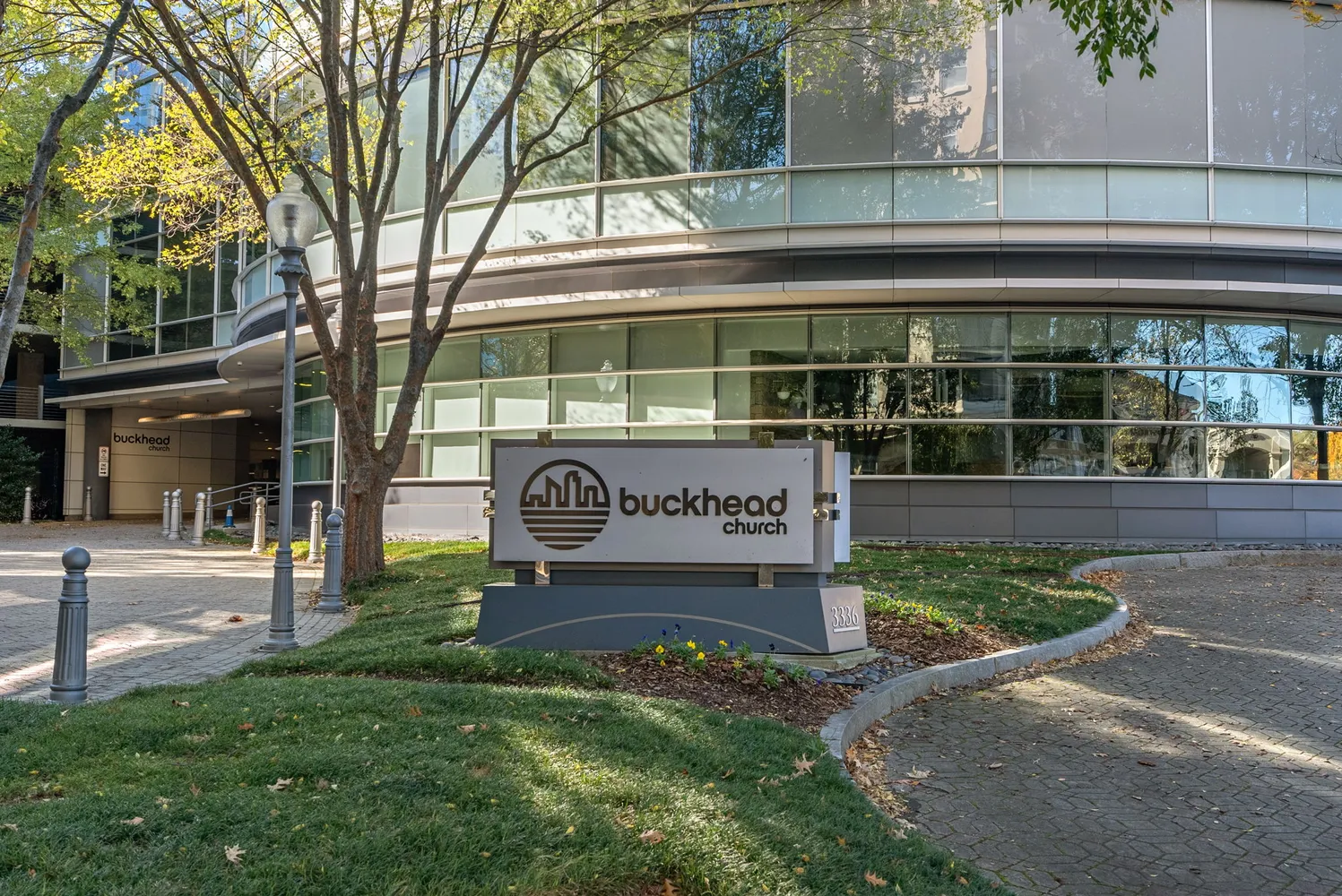 a view of a hallway with wooden floor and dining room