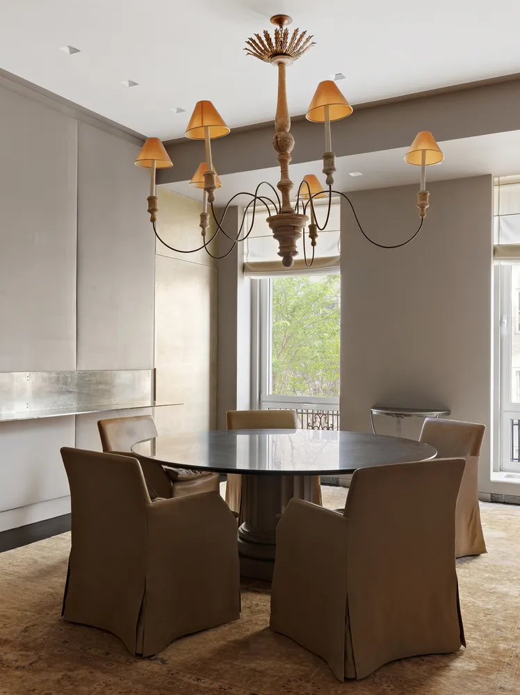 a dining room with furniture and window