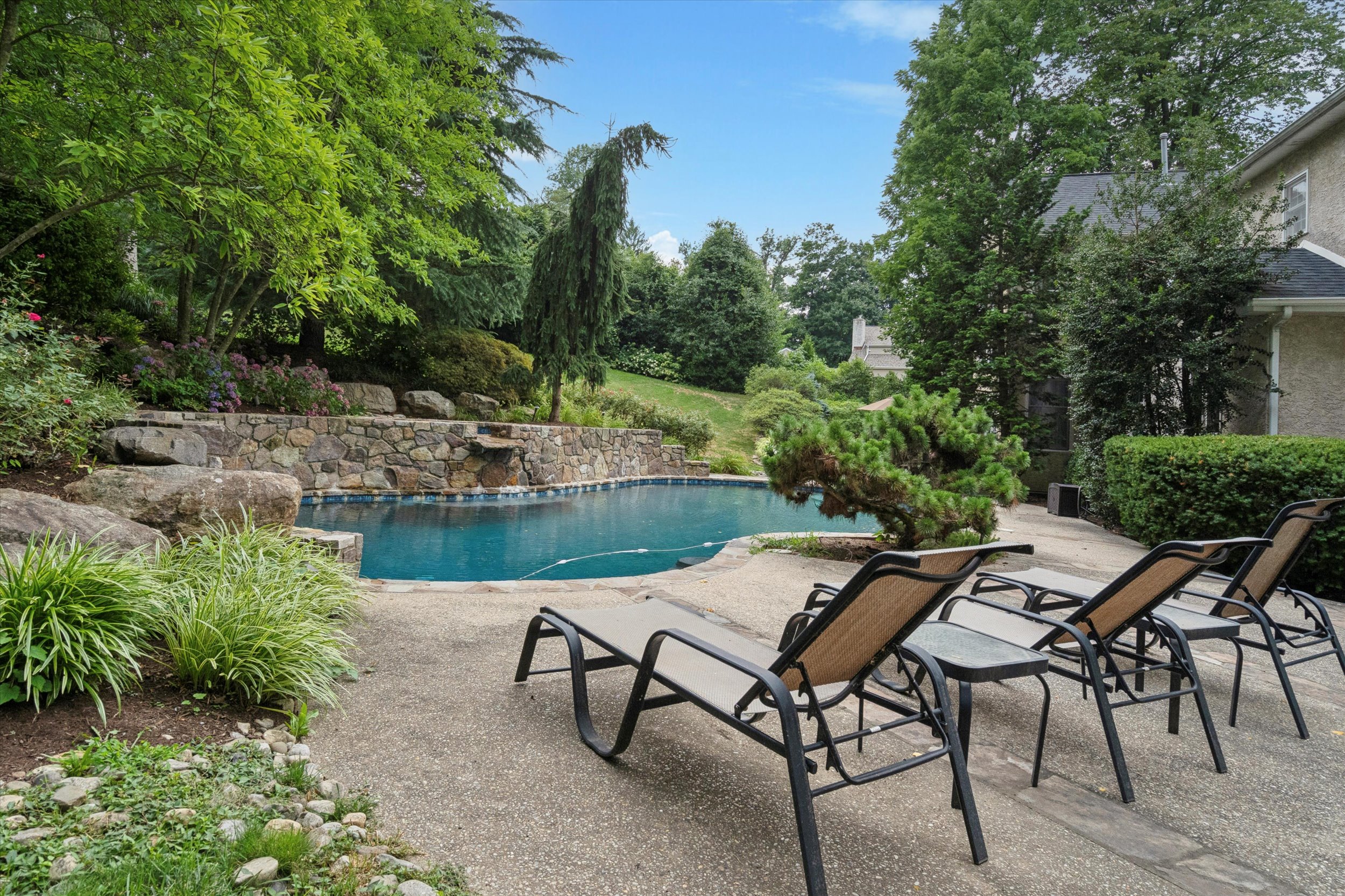 145 Biddulph Road Wayne, PA 19087 - Photo 36 of 39 a view of a lake with table and chairs